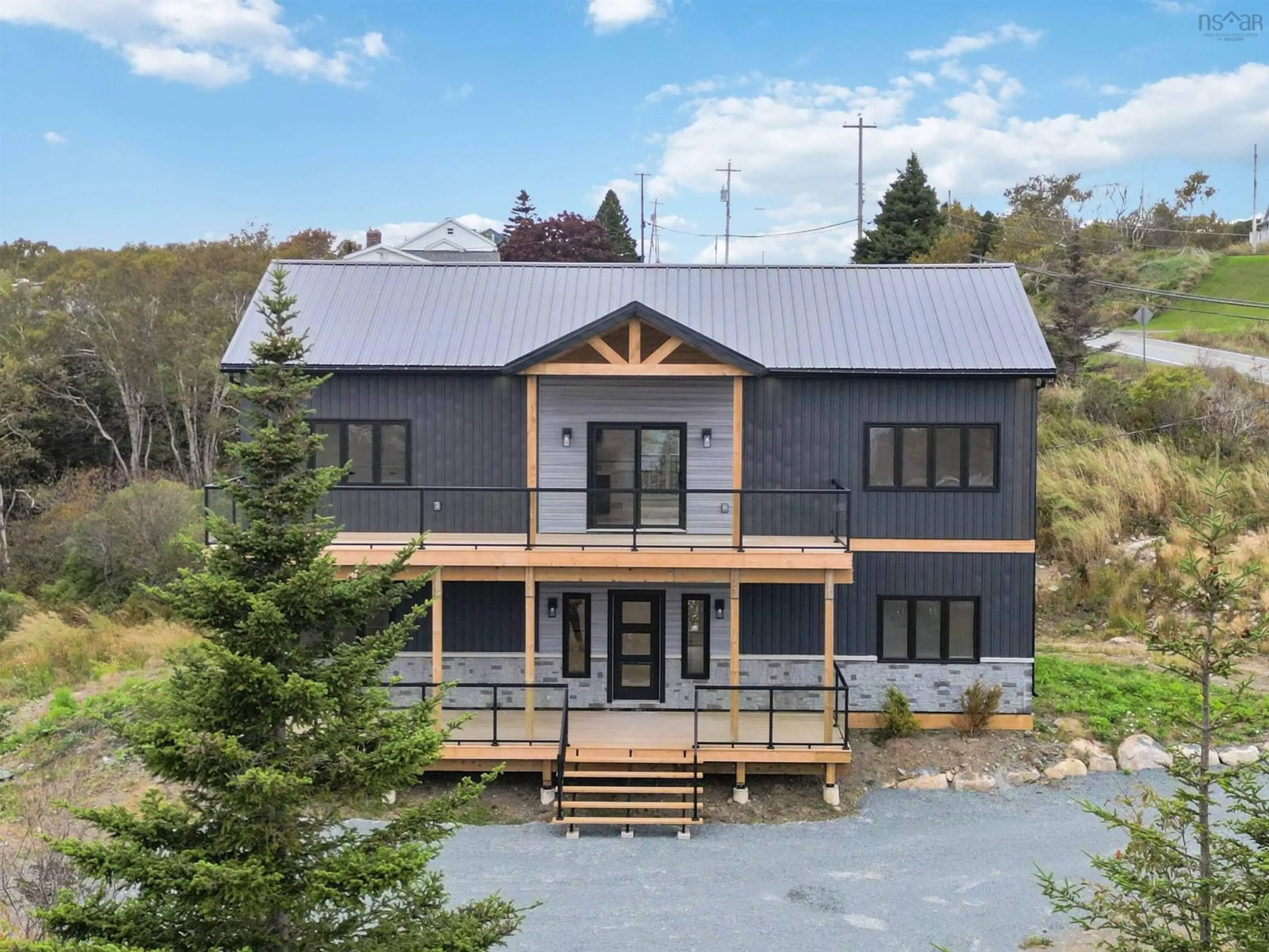 A pic from outside/outdoor area/front of a property/back of a property/a pic from drone, building for 1605 Terence Bay Rd, Terence Bay Nova Scotia B3T 1X9