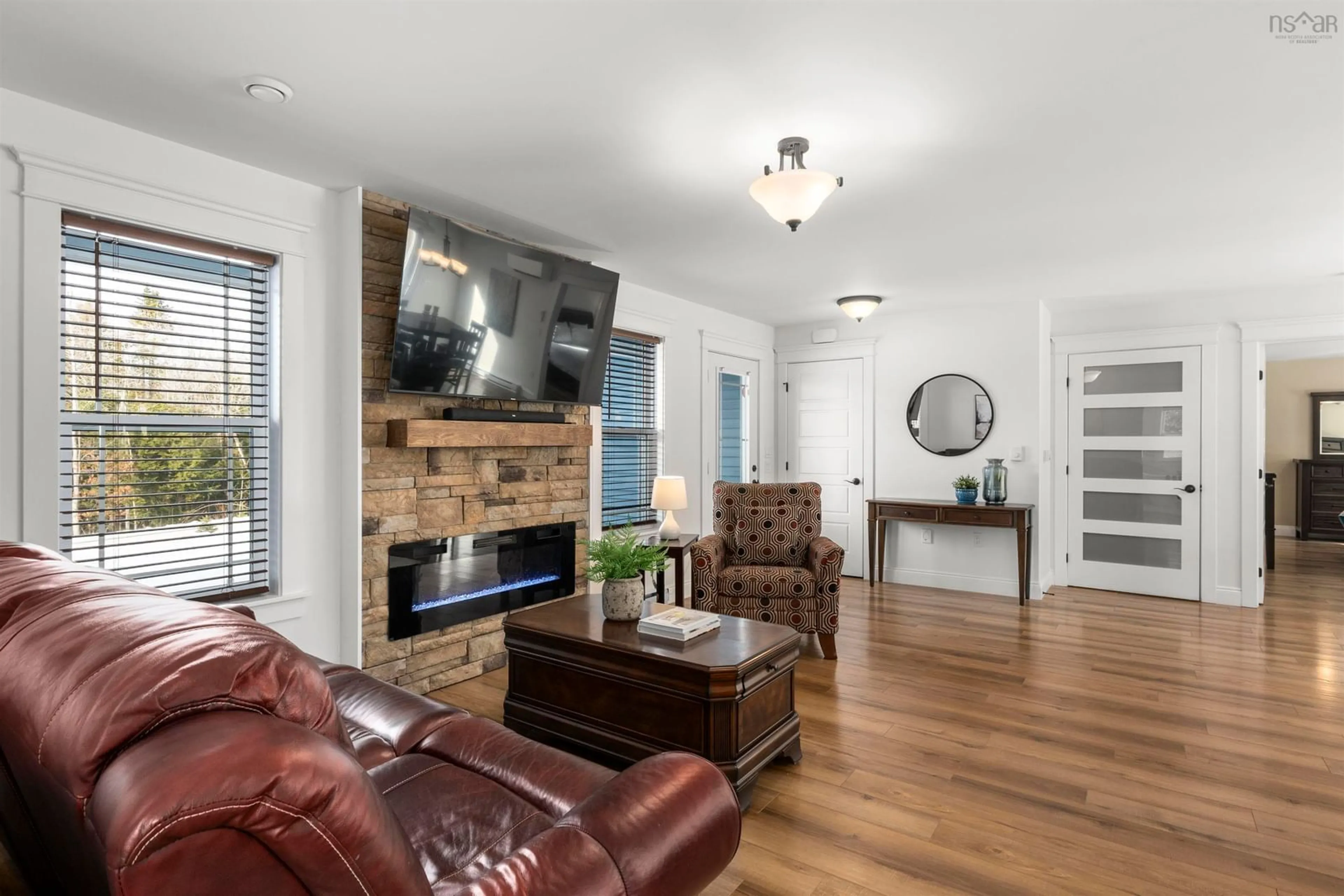 Living room with furniture, wood/laminate floor for 458 Calderwood Dr, Wellington Nova Scotia B2T 0S2