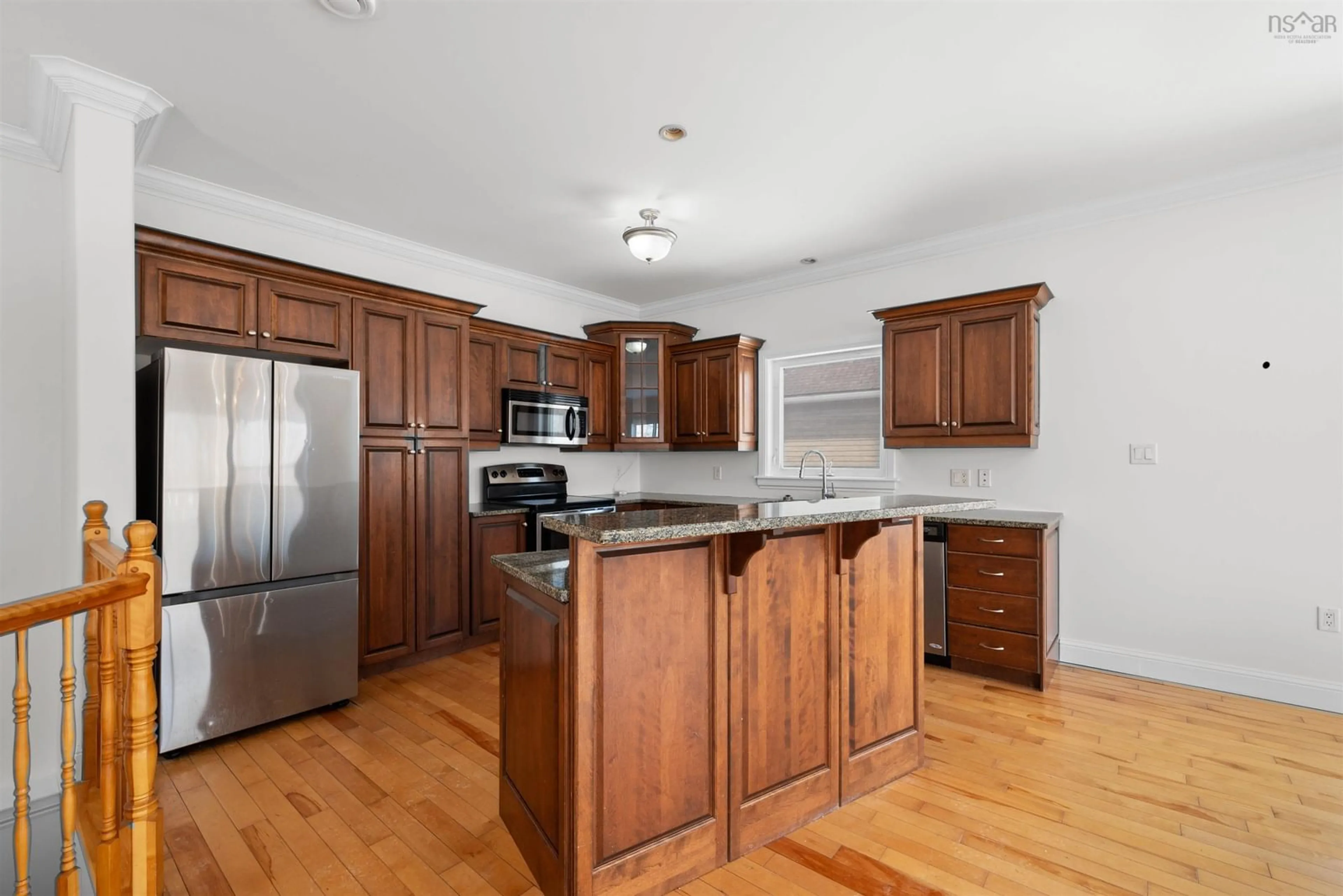 Open concept kitchen, wood/laminate floor for 65 Carnoustie Drive, Hammonds Plains Nova Scotia B4B 0E5