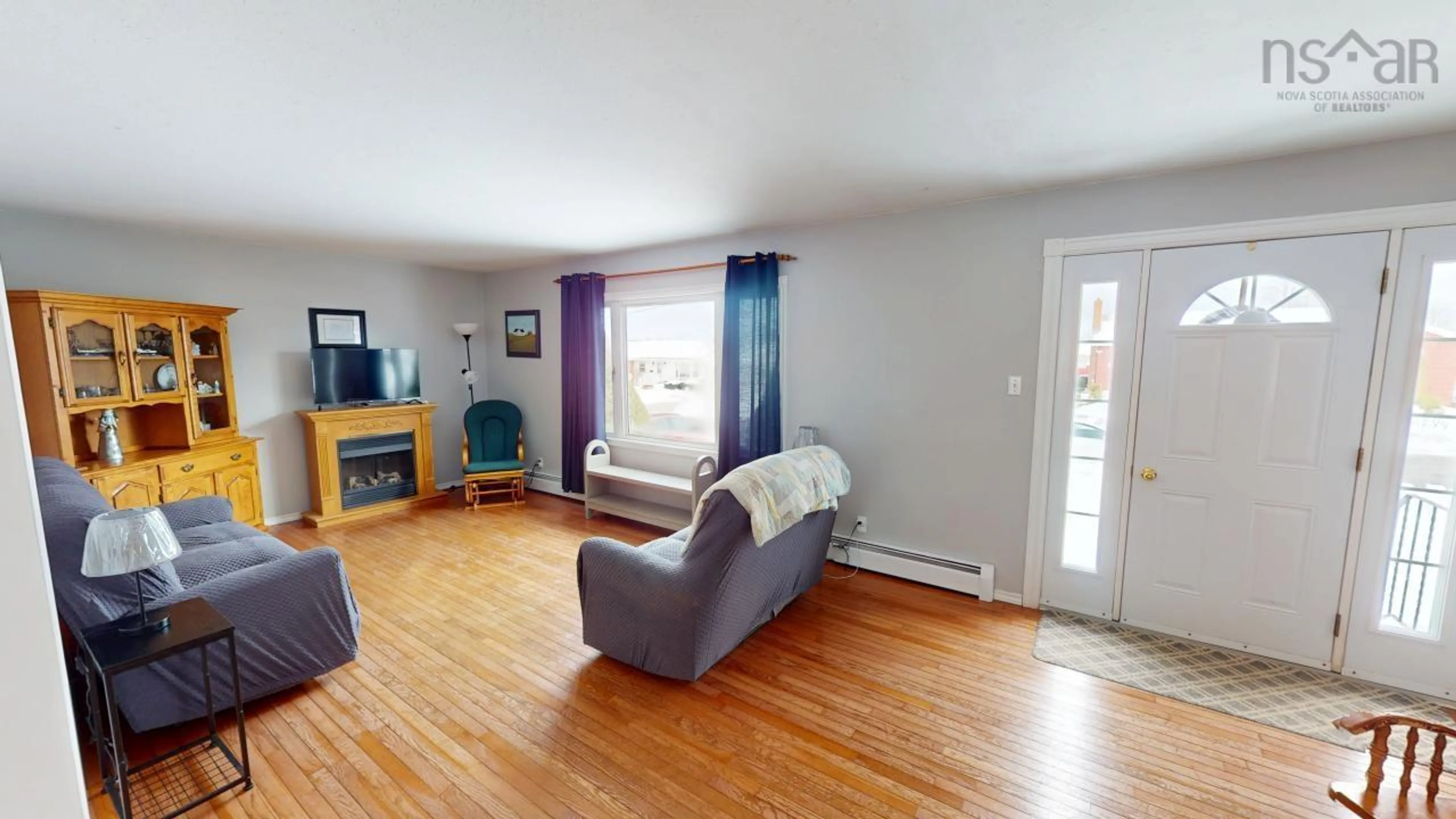 Living room with furniture, wood/laminate floor for 6 Ross St, Antigonish Nova Scotia B2G 1C6