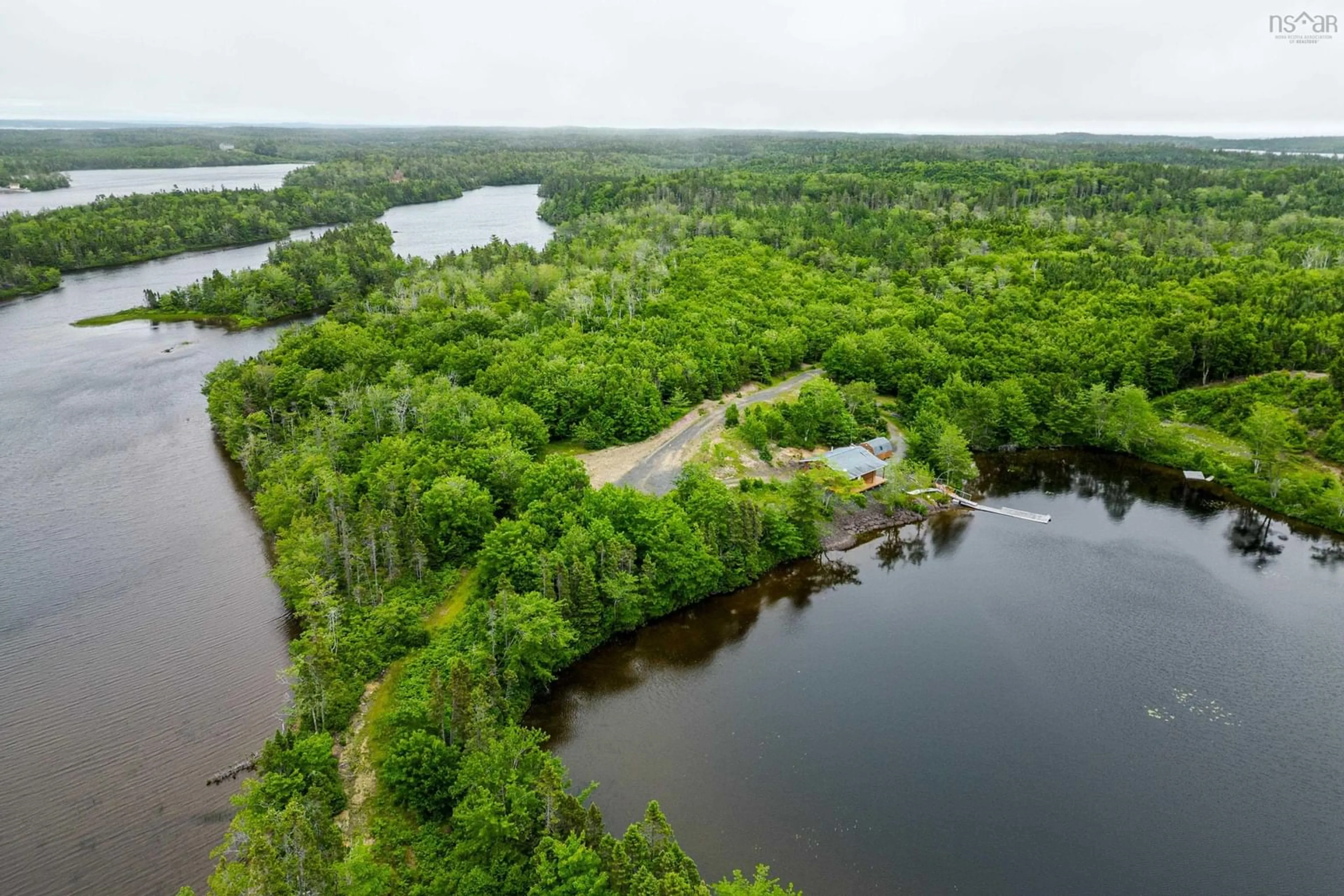 A pic from outside/outdoor area/front of a property/back of a property/a pic from drone, water/lake/river/ocean view for 469 South Grand Lake Rd, Arichat Nova Scotia B0E 1A0