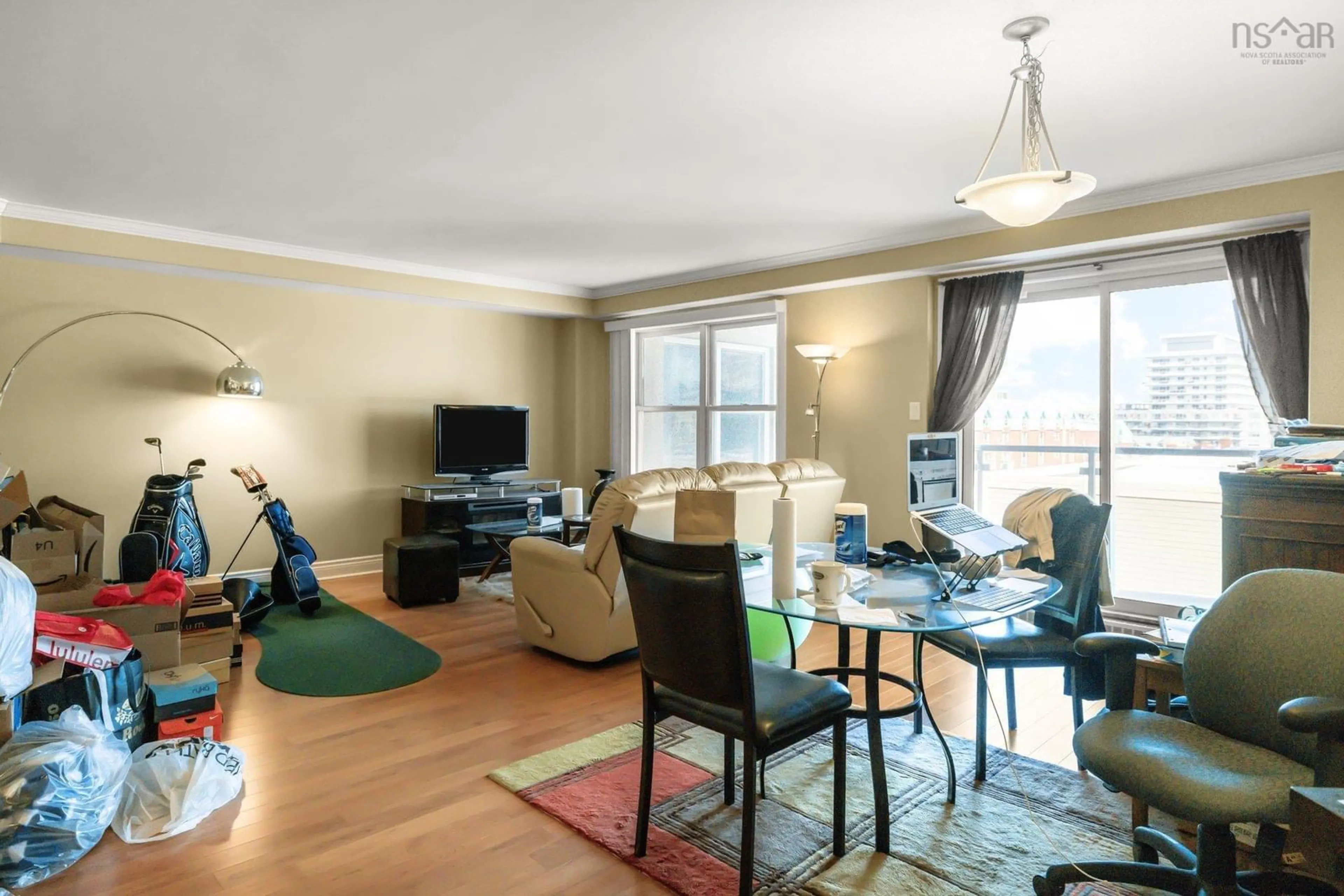 Living room with furniture, wood/laminate floor for 404 5234 Morris St, Halifax Peninsula Nova Scotia B3J 0A3