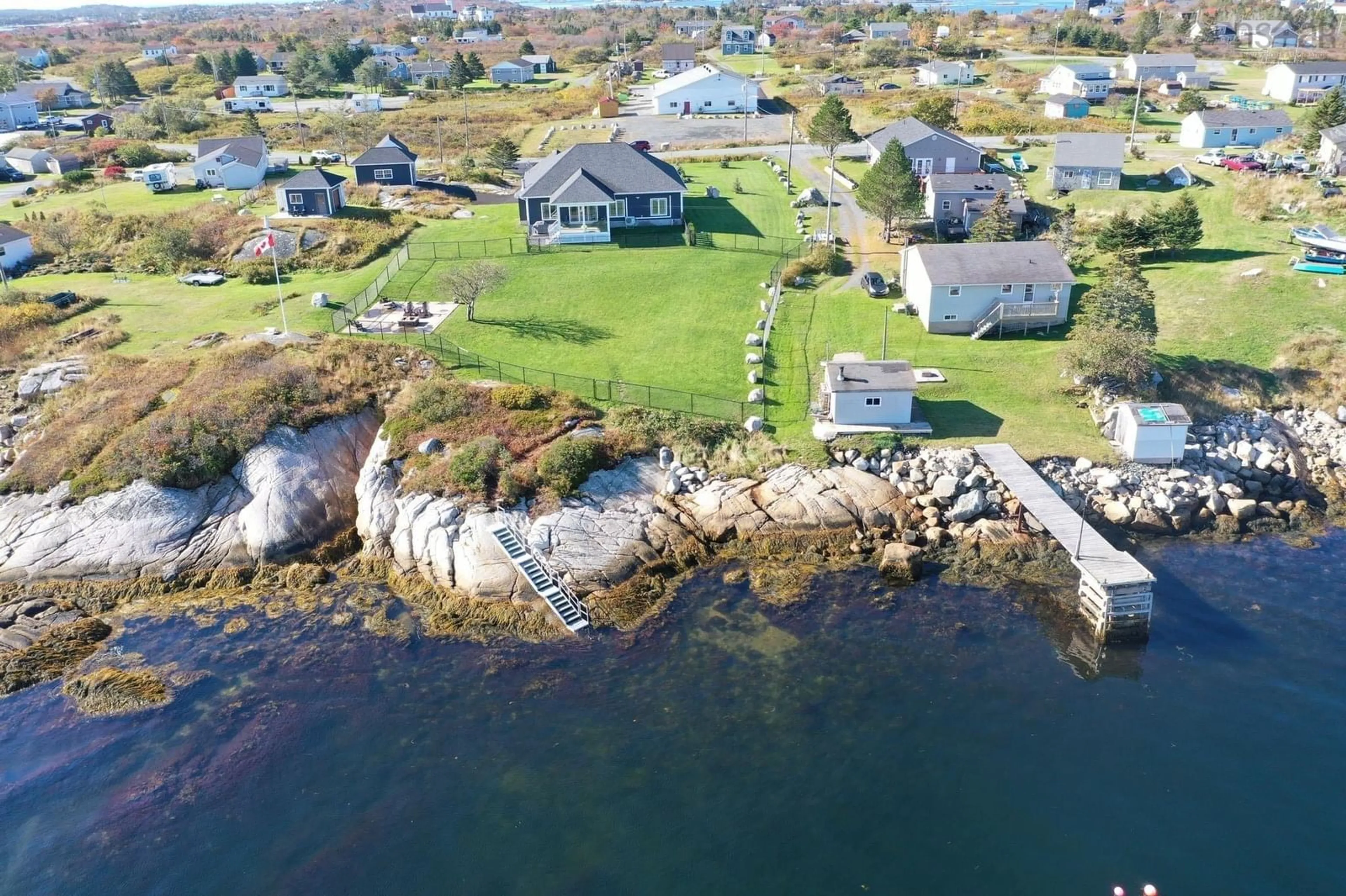 A pic from outside/outdoor area/front of a property/back of a property/a pic from drone, water/lake/river/ocean view for 21 Back Lane, Terence Bay Nova Scotia B3T 1Y3