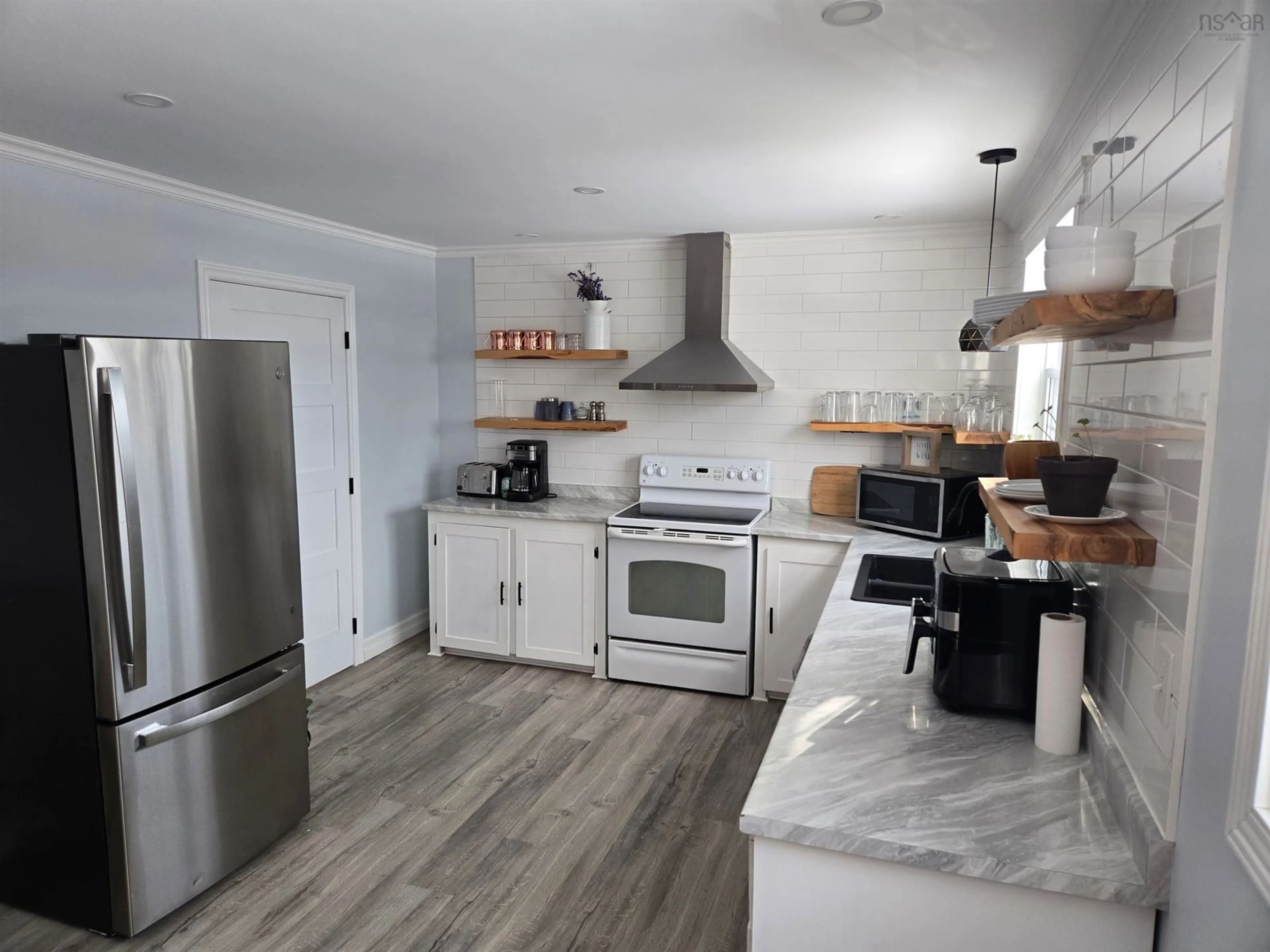 Open concept kitchen, unknown for 20 Evelyns Ave, Georges River Nova Scotia B1Y 3G6