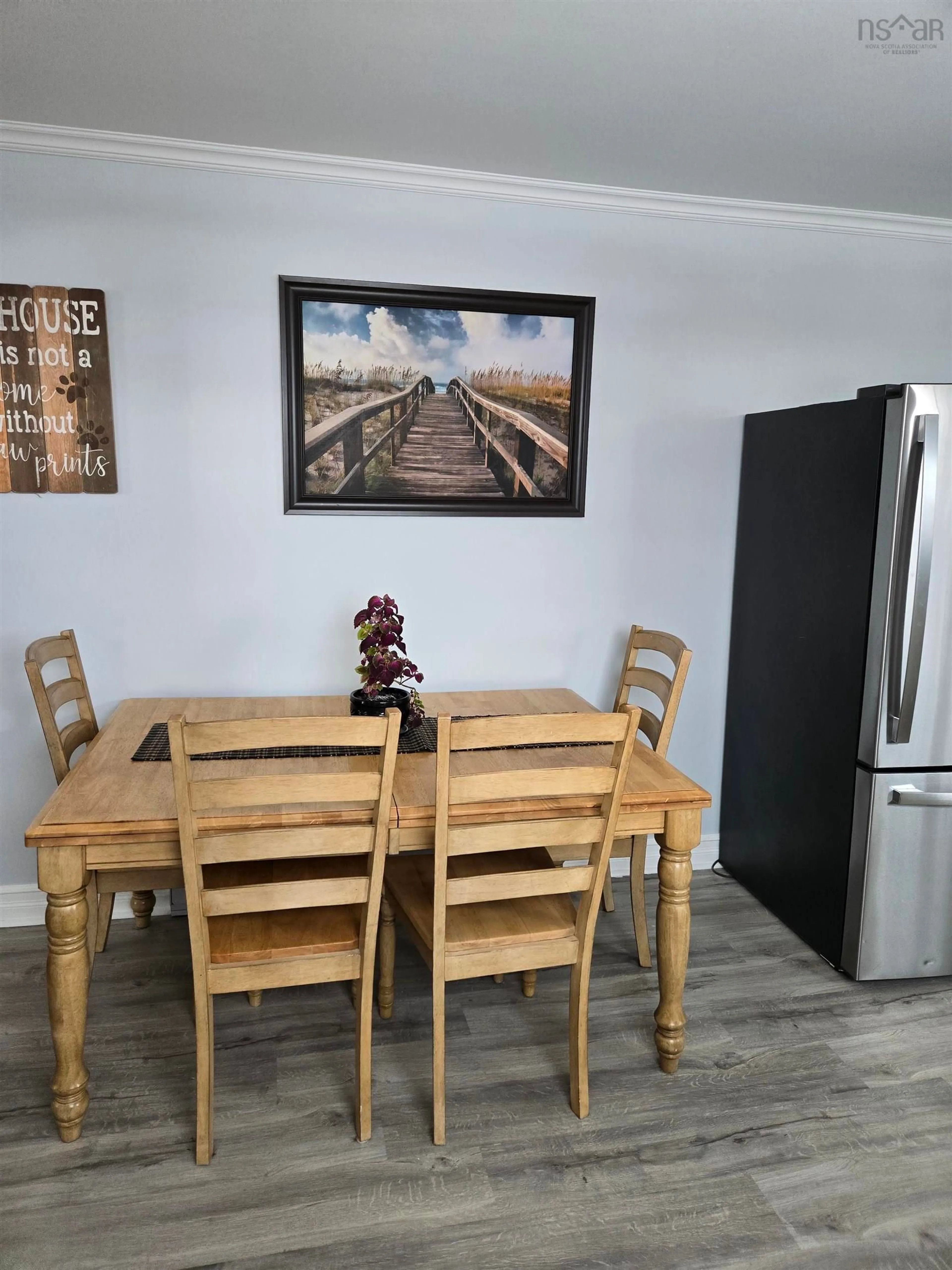 Dining room, wood/laminate floor for 20 Evelyns Ave, Georges River Nova Scotia B1Y 3G6