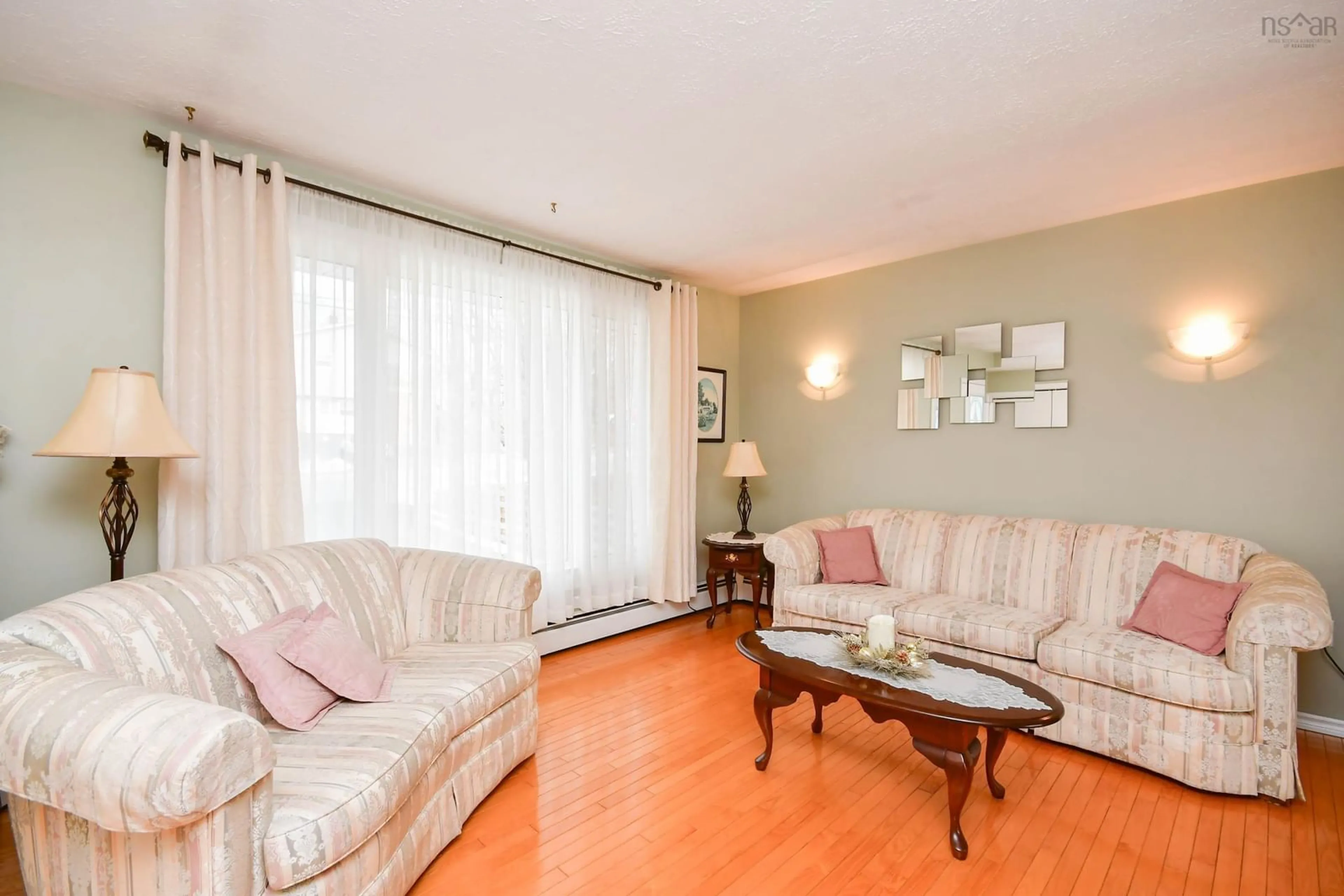 Living room with furniture, wood/laminate floor for 138 Prince St, Lower Sackville Nova Scotia B4C 1L5