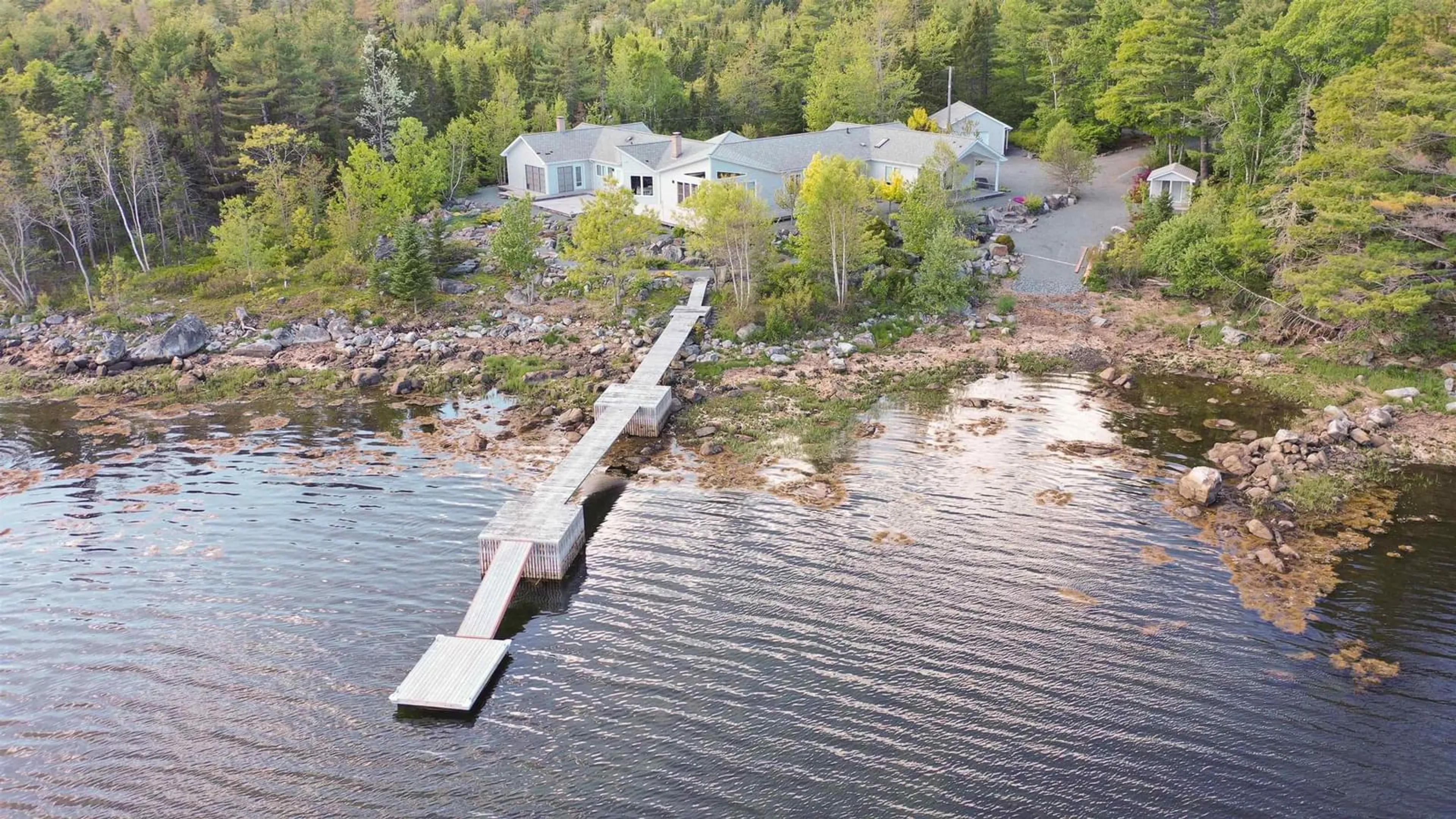 A pic from outside/outdoor area/front of a property/back of a property/a pic from drone, water/lake/river/ocean view for 668 Highway 331, East Port Medway Nova Scotia B0J 2H0