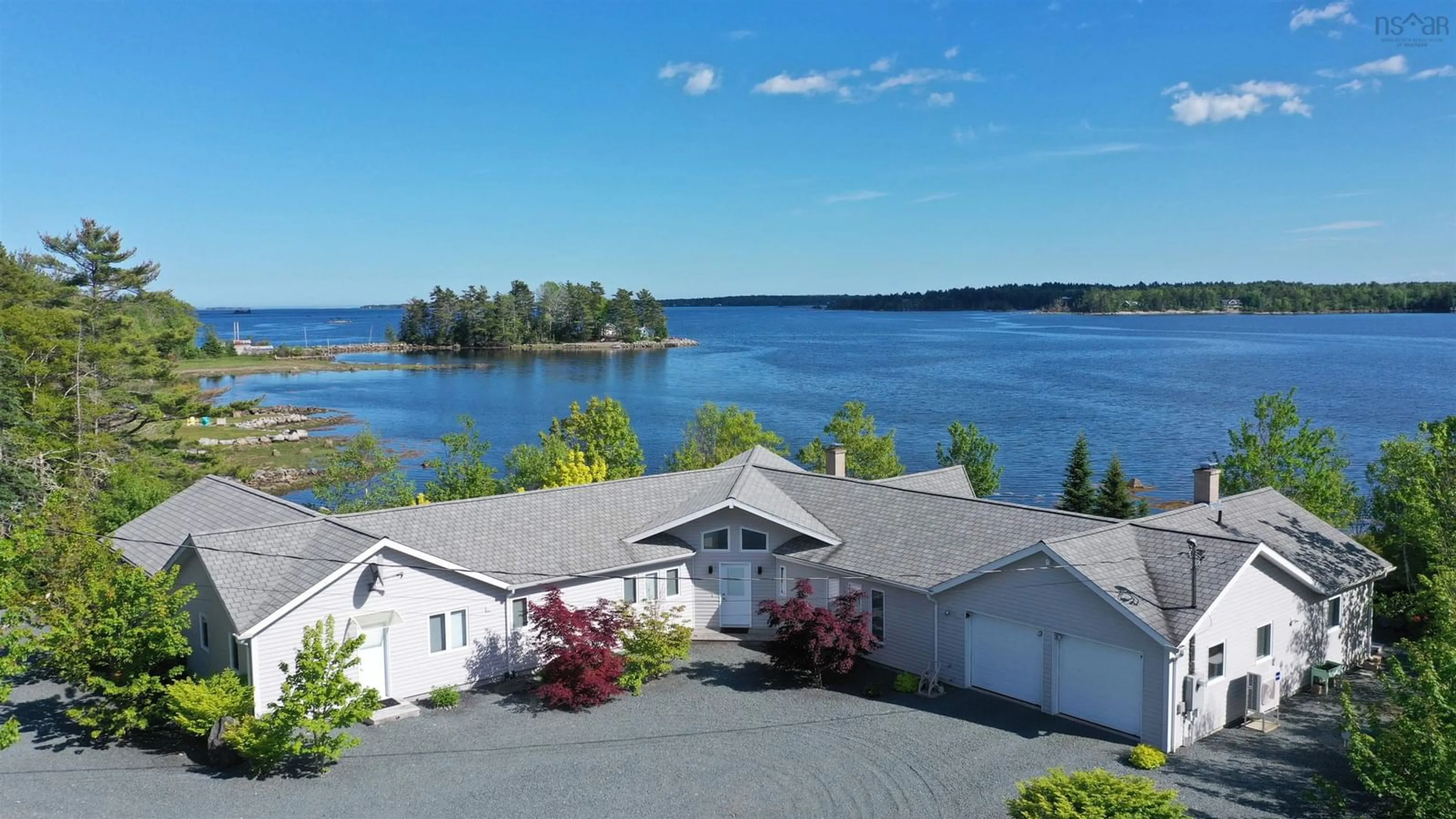 A pic from outside/outdoor area/front of a property/back of a property/a pic from drone, water/lake/river/ocean view for 668 Highway 331, East Port Medway Nova Scotia B0J 2H0