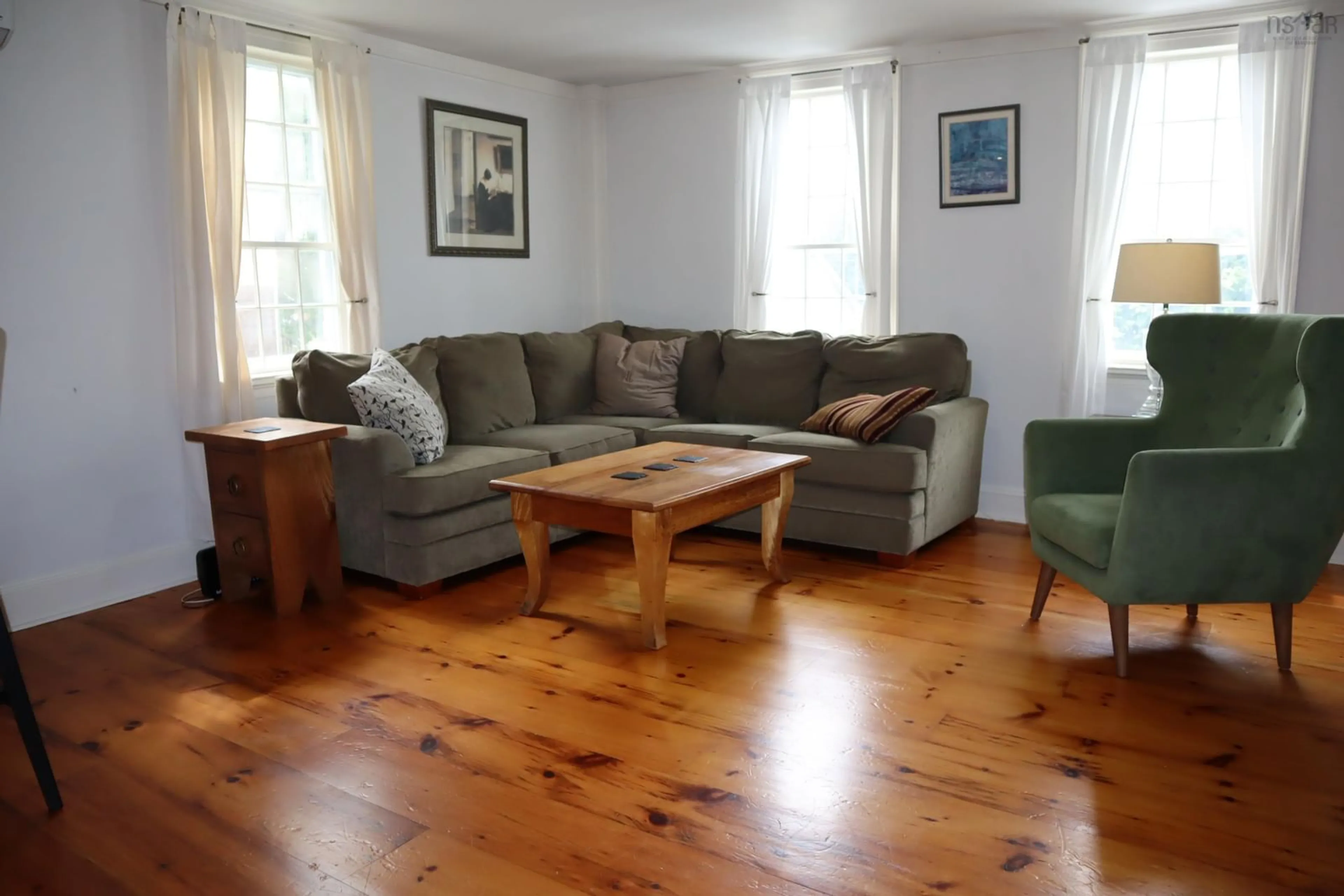 Living room with furniture, wood/laminate floor for 71 Main St, Liverpool Nova Scotia B0T 1K0