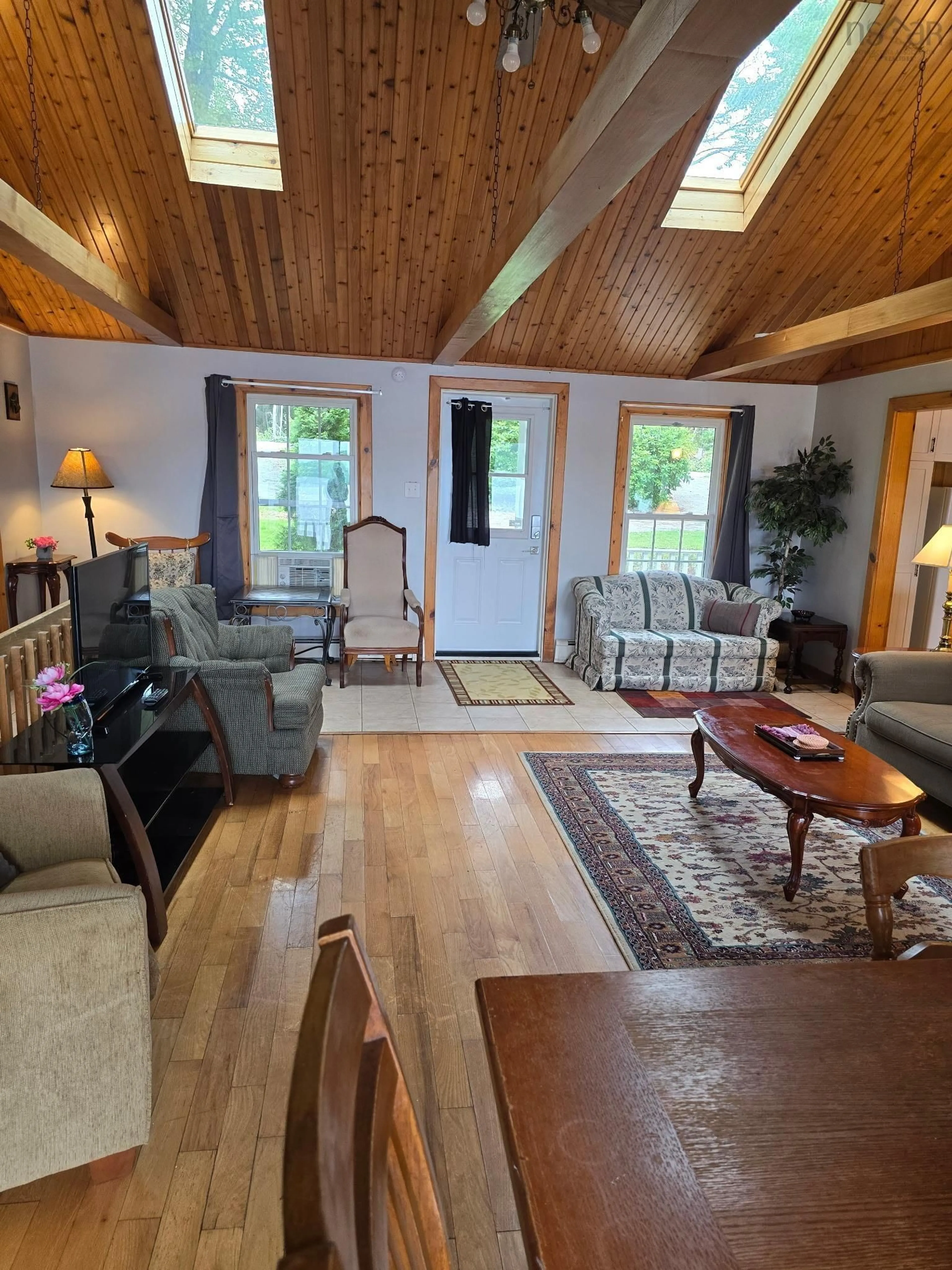 Living room with furniture, wood/laminate floor for 253 Perry Rd, Carleton Nova Scotia B5A 5R2