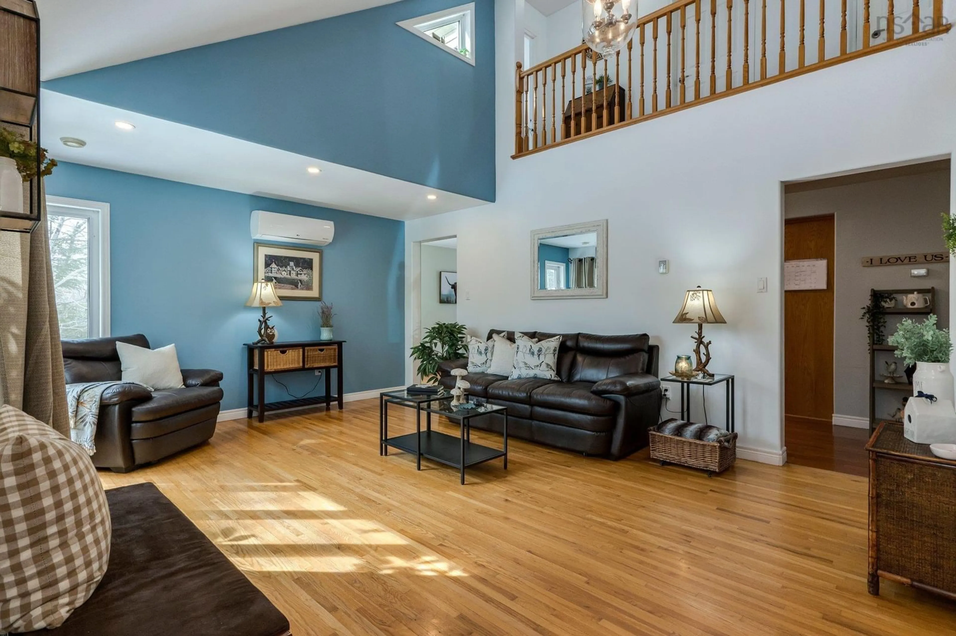 Living room with furniture, wood/laminate floor for 290 Buckingham Drive, Stillwater Lake Nova Scotia B3Z 1G8