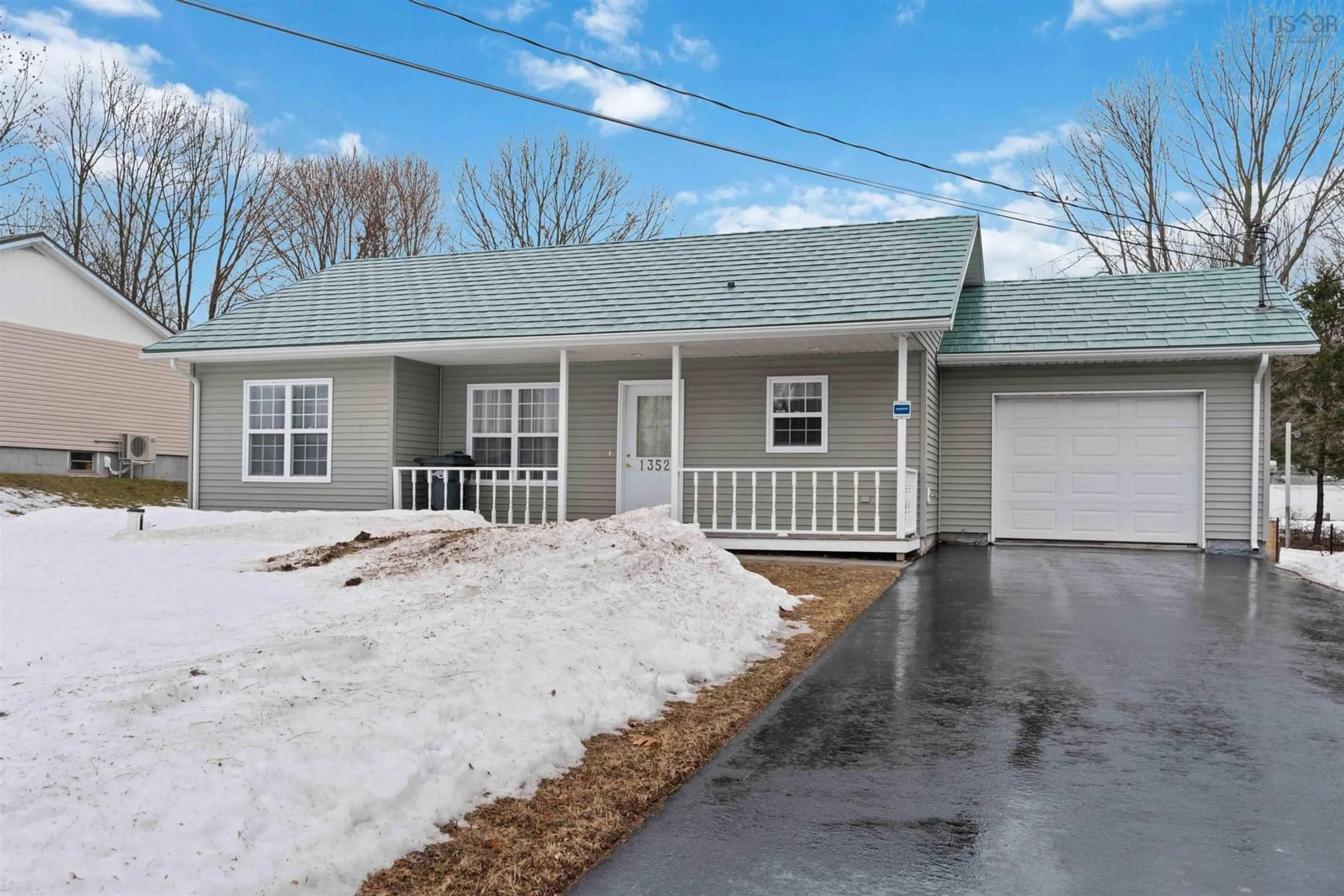 Home with vinyl exterior material, street for 1352 Spring Garden Rd, Kingston Nova Scotia B0P 1R0