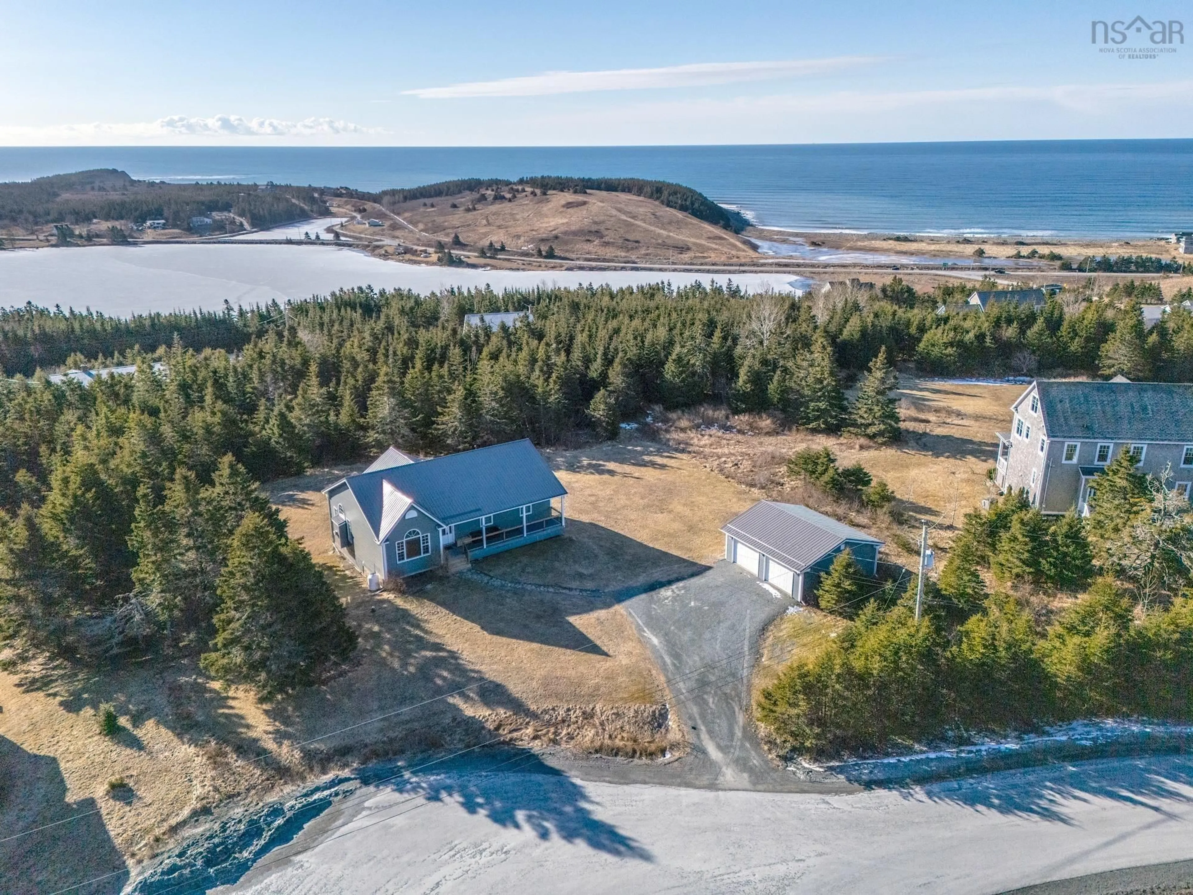 A pic from outside/outdoor area/front of a property/back of a property/a pic from drone, water/lake/river/ocean view for 21 Leeward Lane, East Lawrencetown Nova Scotia B2X 1V2