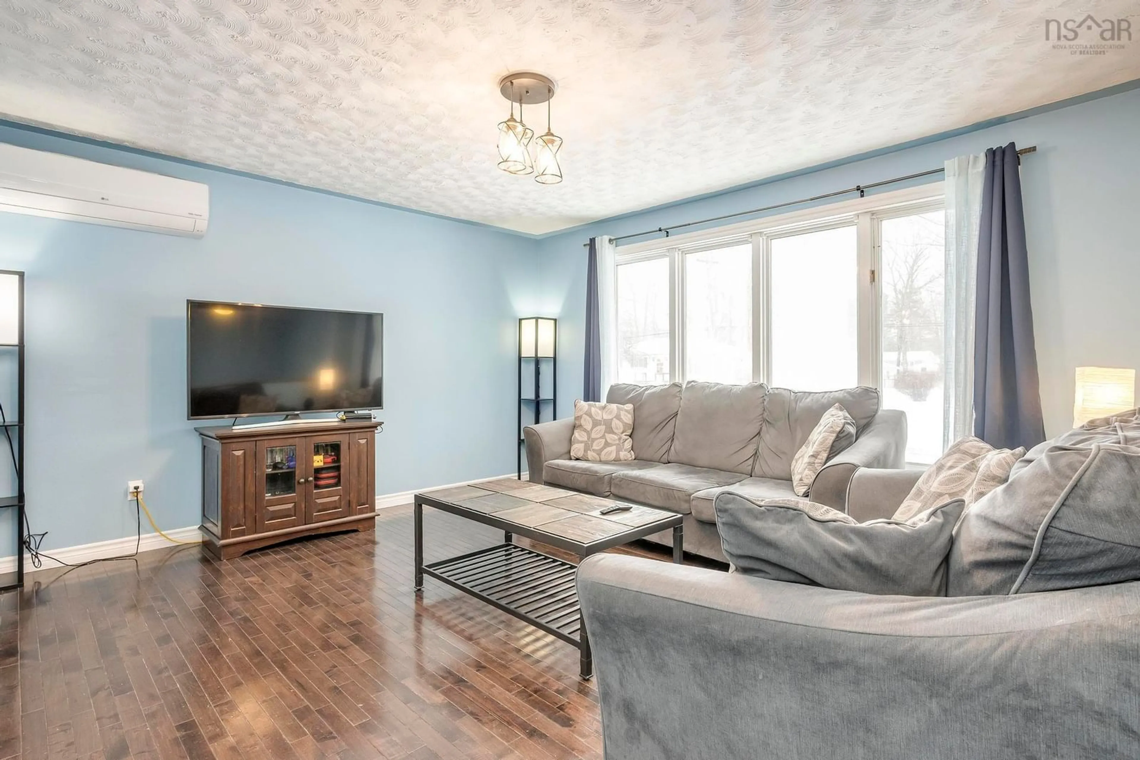 Living room with furniture, wood/laminate floor for 831 Beaver St, Greenwood Nova Scotia B0P 1N0