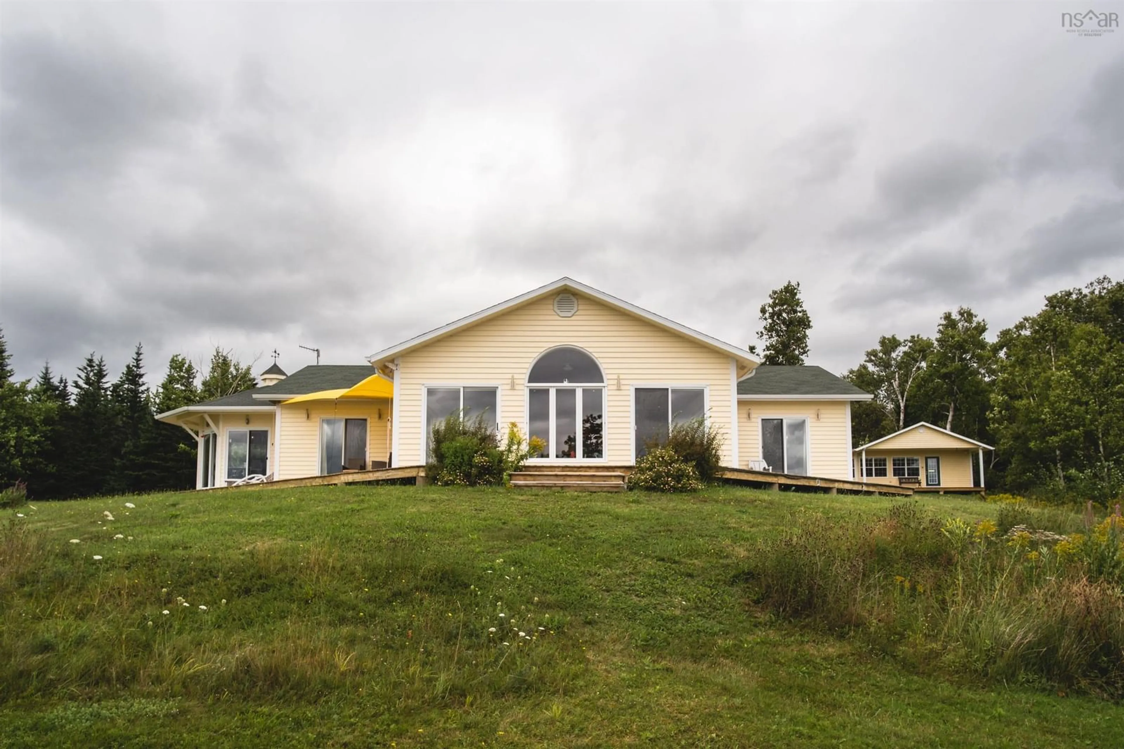 A pic from outside/outdoor area/front of a property/back of a property/a pic from drone, building for 364 (6012) Macinnis Point Rd, Marble Mountain Nova Scotia B0E 3K0
