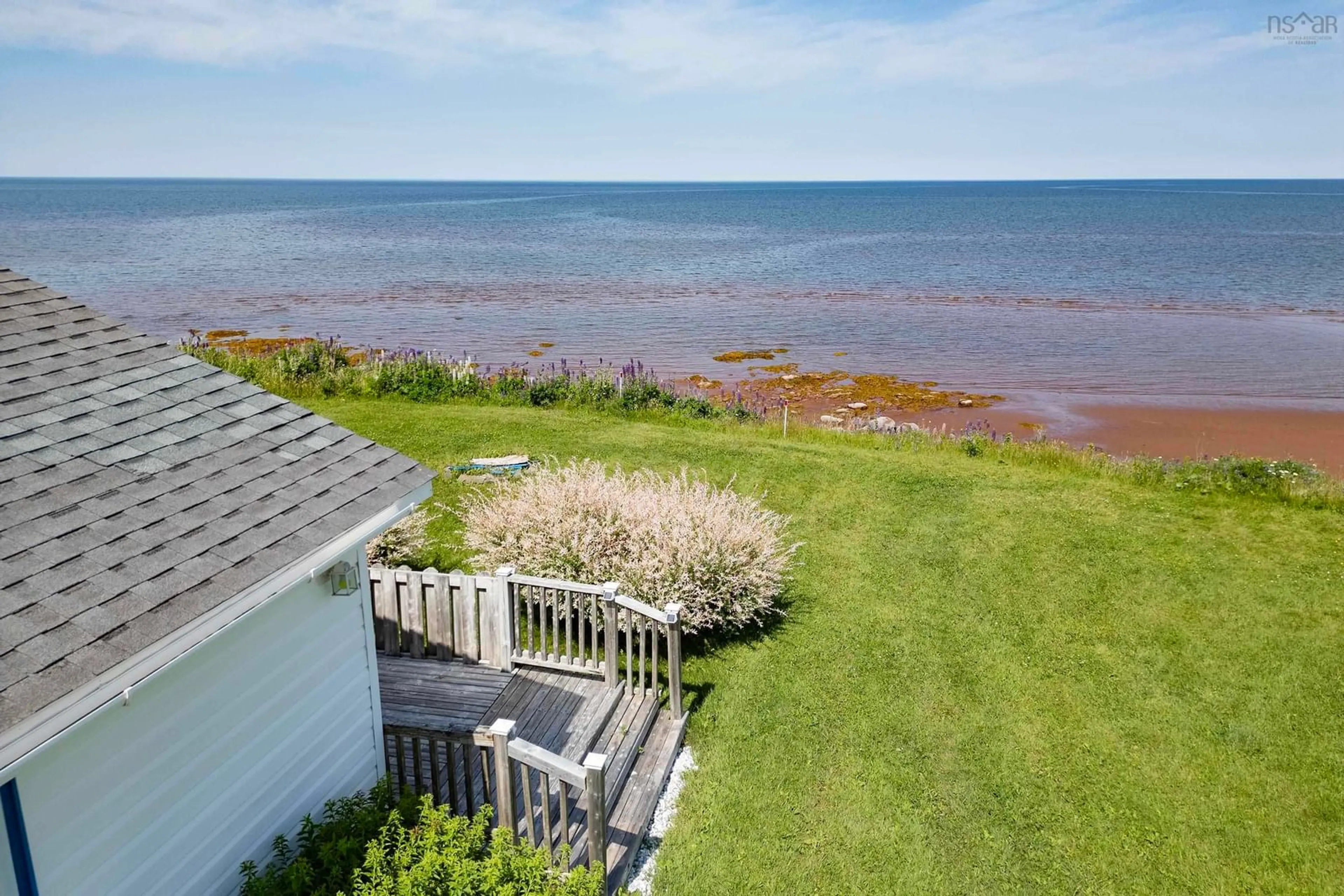 A pic from outside/outdoor area/front of a property/back of a property/a pic from drone, water/lake/river/ocean view for 130 Beach Rd, Port Howe Nova Scotia B0K 1K0