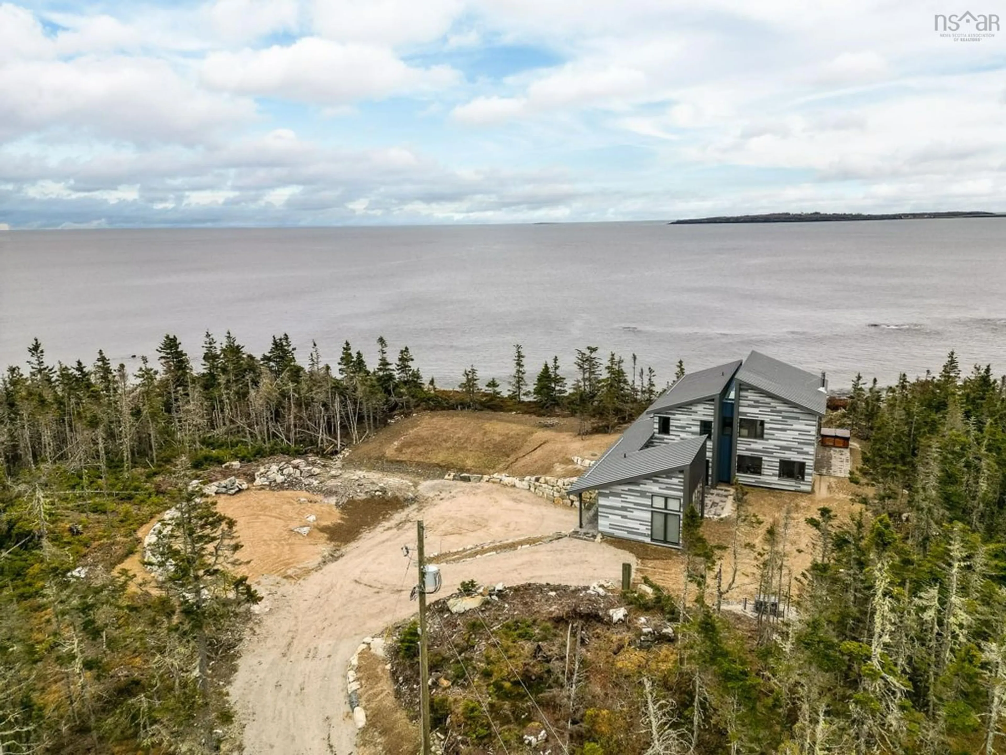 A pic from outside/outdoor area/front of a property/back of a property/a pic from drone, water/lake/river/ocean view for 112 Herring Point Rd, Blandford Nova Scotia B0J 1T0
