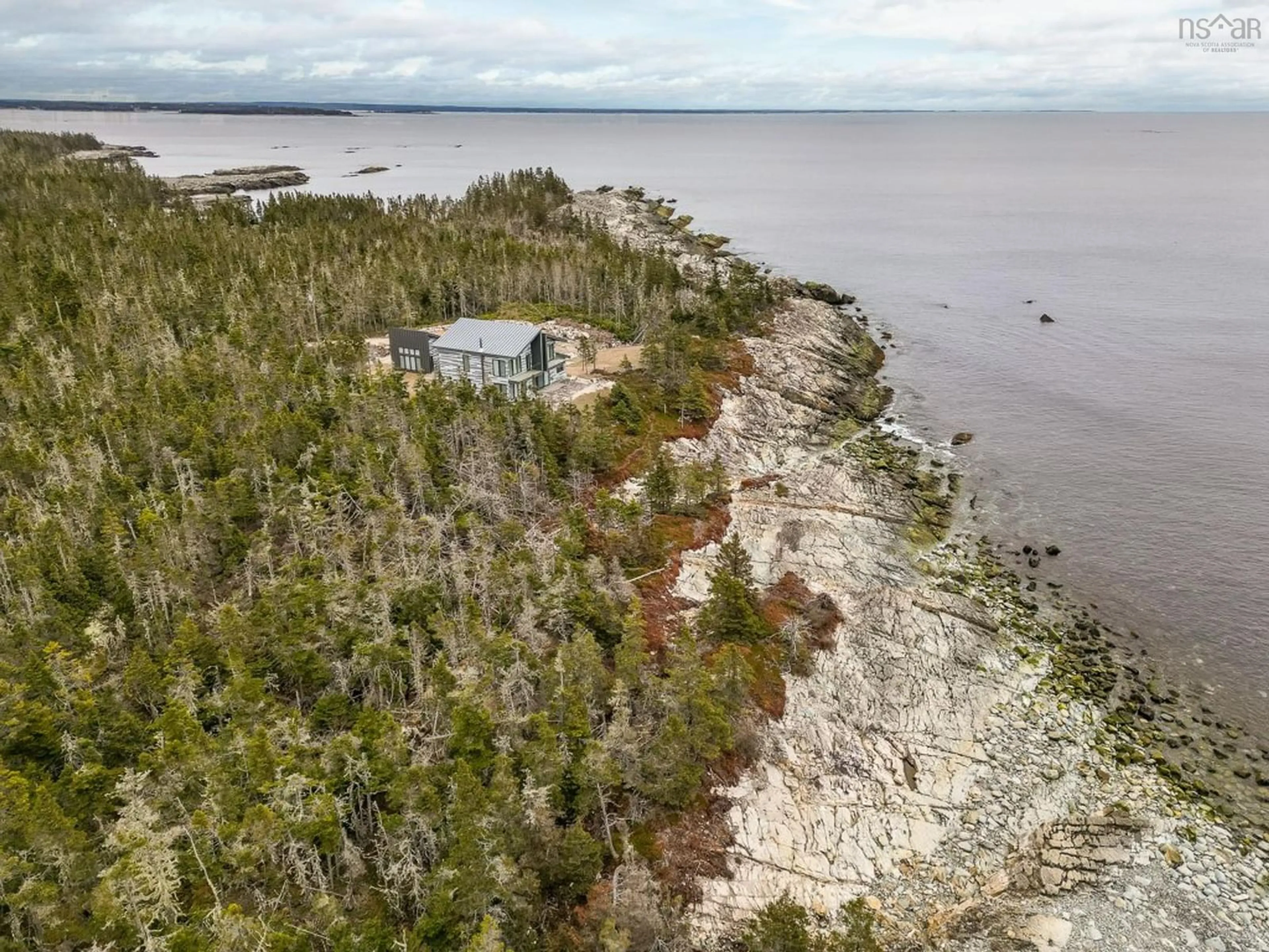A pic from outside/outdoor area/front of a property/back of a property/a pic from drone, water/lake/river/ocean view for 112 Herring Point Rd, Blandford Nova Scotia B0J 1T0