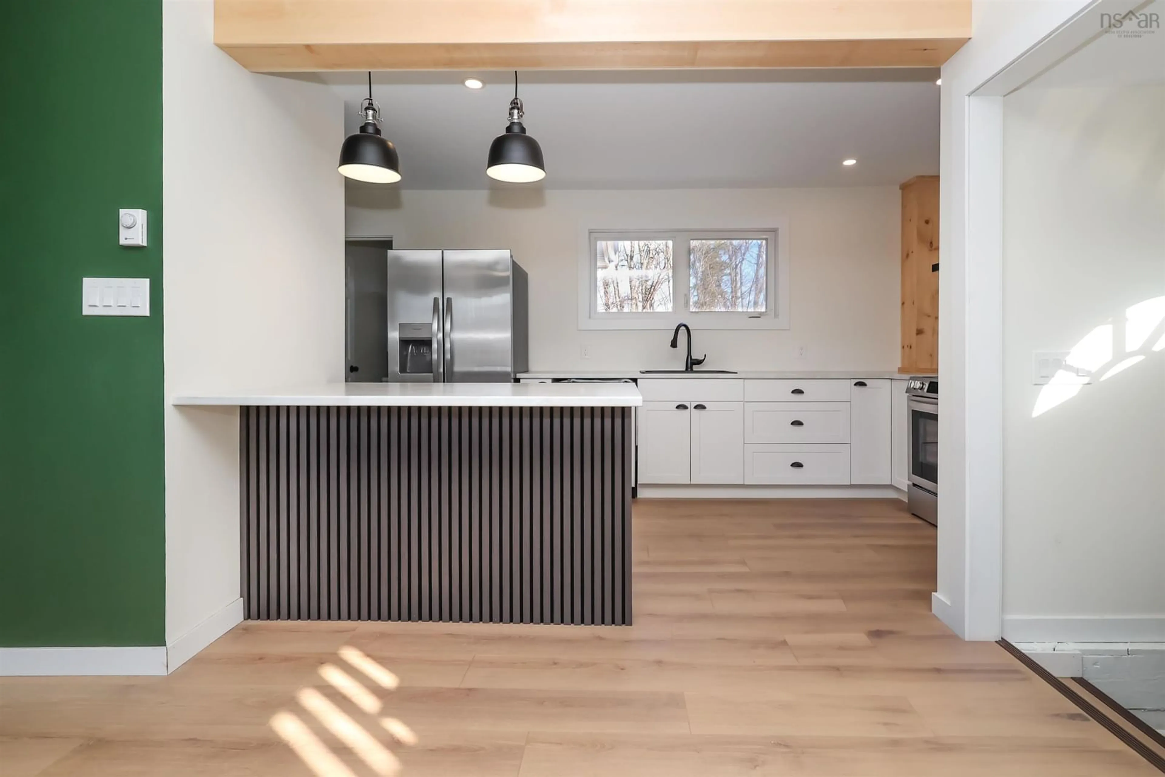 Open concept kitchen, wood/laminate floor for 10 View St, Sydney Mines Nova Scotia B1V 1G7