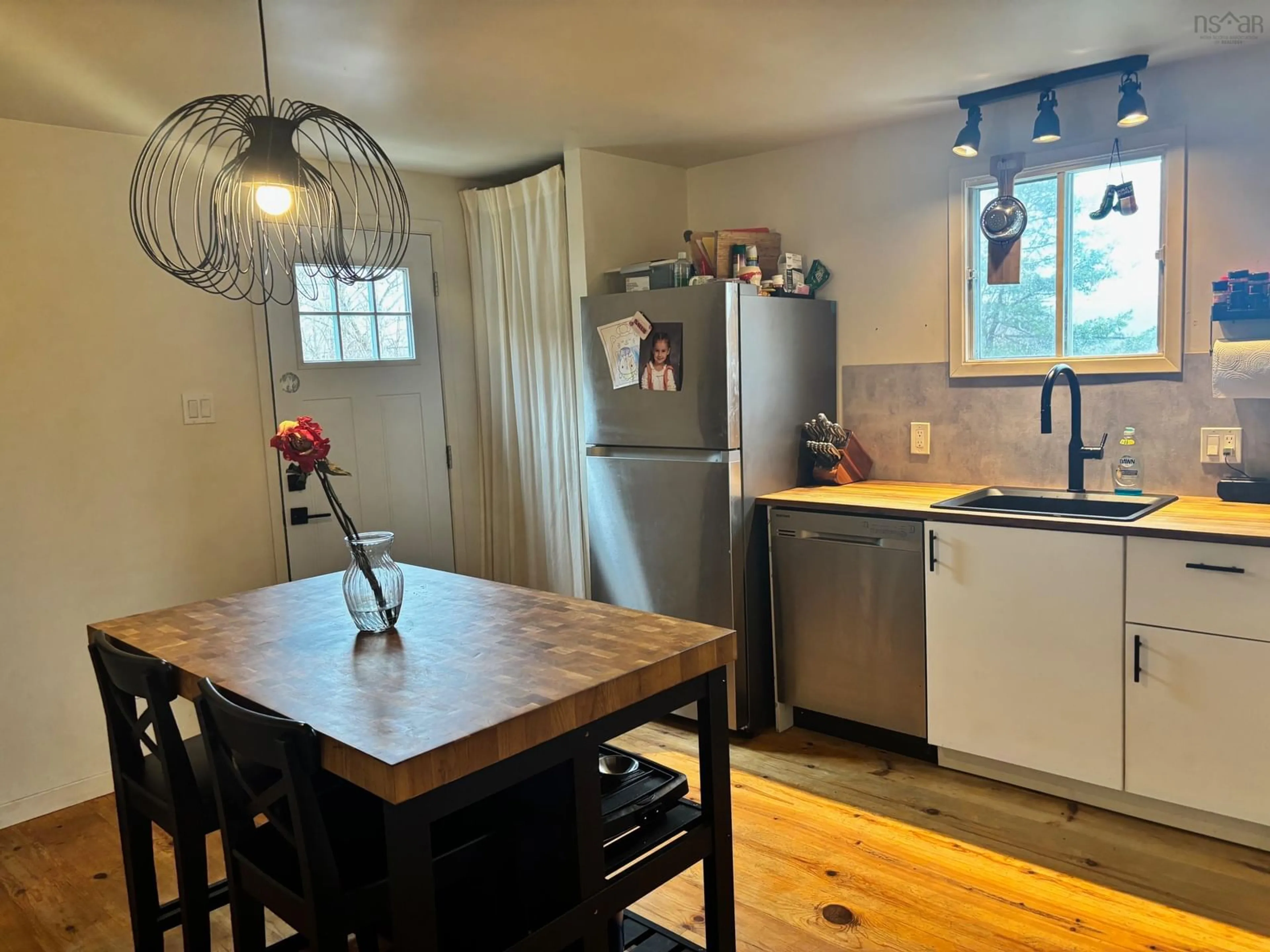 Open concept kitchen, wood/laminate floor for 312 East River Rd, Sheet Harbour Nova Scotia B0J 3B0