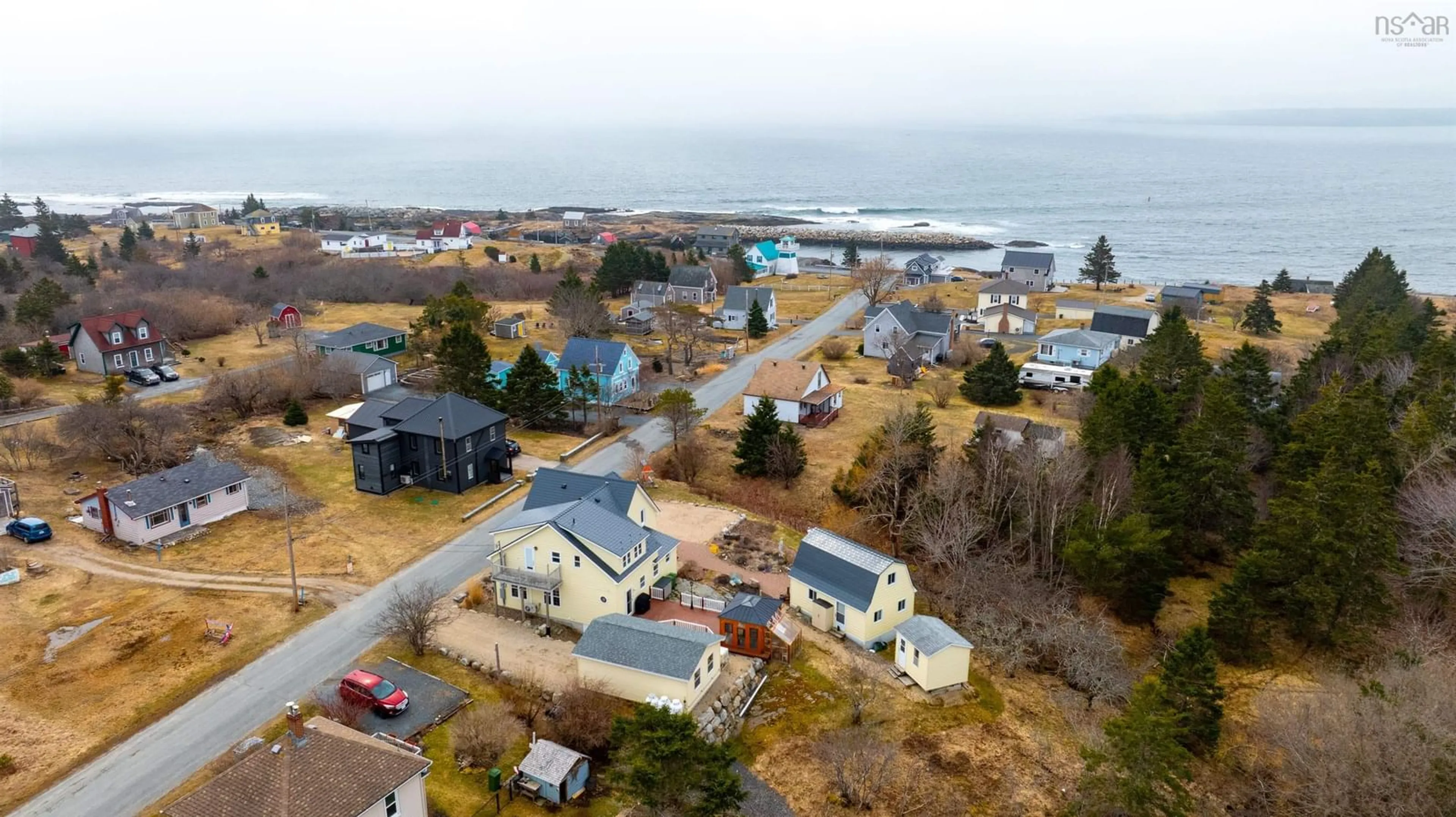 A pic from outside/outdoor area/front of a property/back of a property/a pic from drone, water/lake/river/ocean view for 20 The Lane, Blue Rocks Nova Scotia B0J 2C0