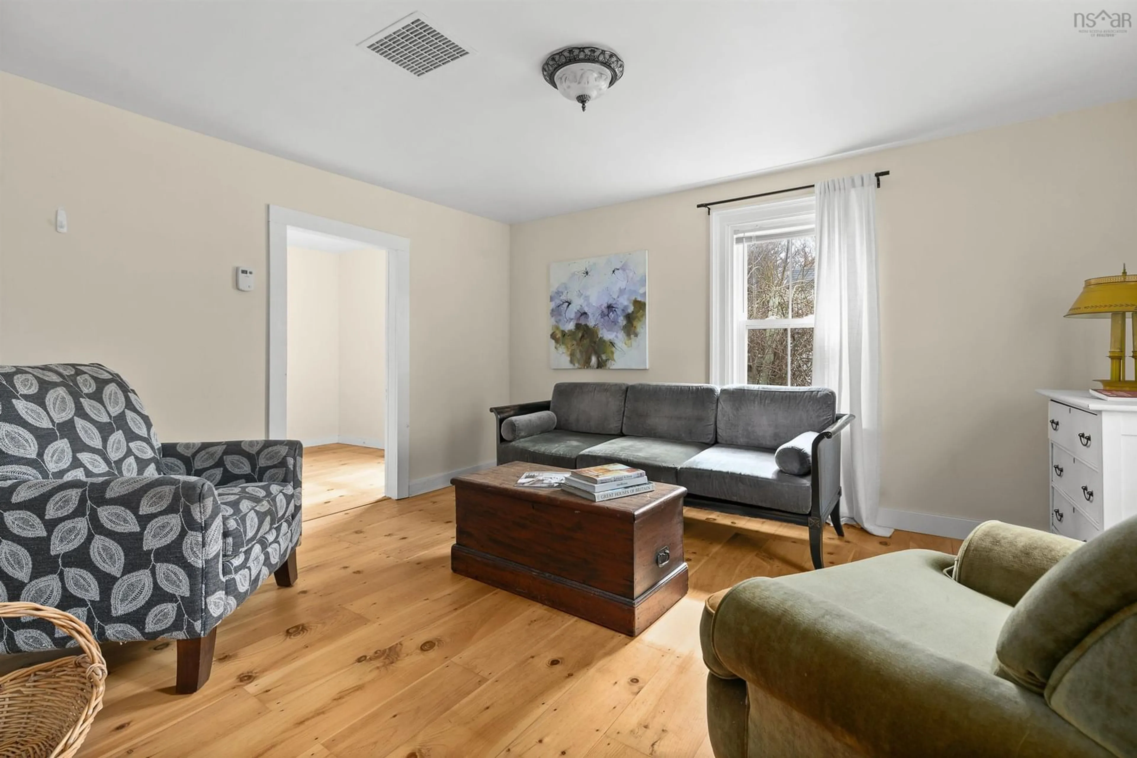 Living room with furniture, wood/laminate floor for 1999 Italy Cross Rd, Petite Rivière Nova Scotia B4V 5X2