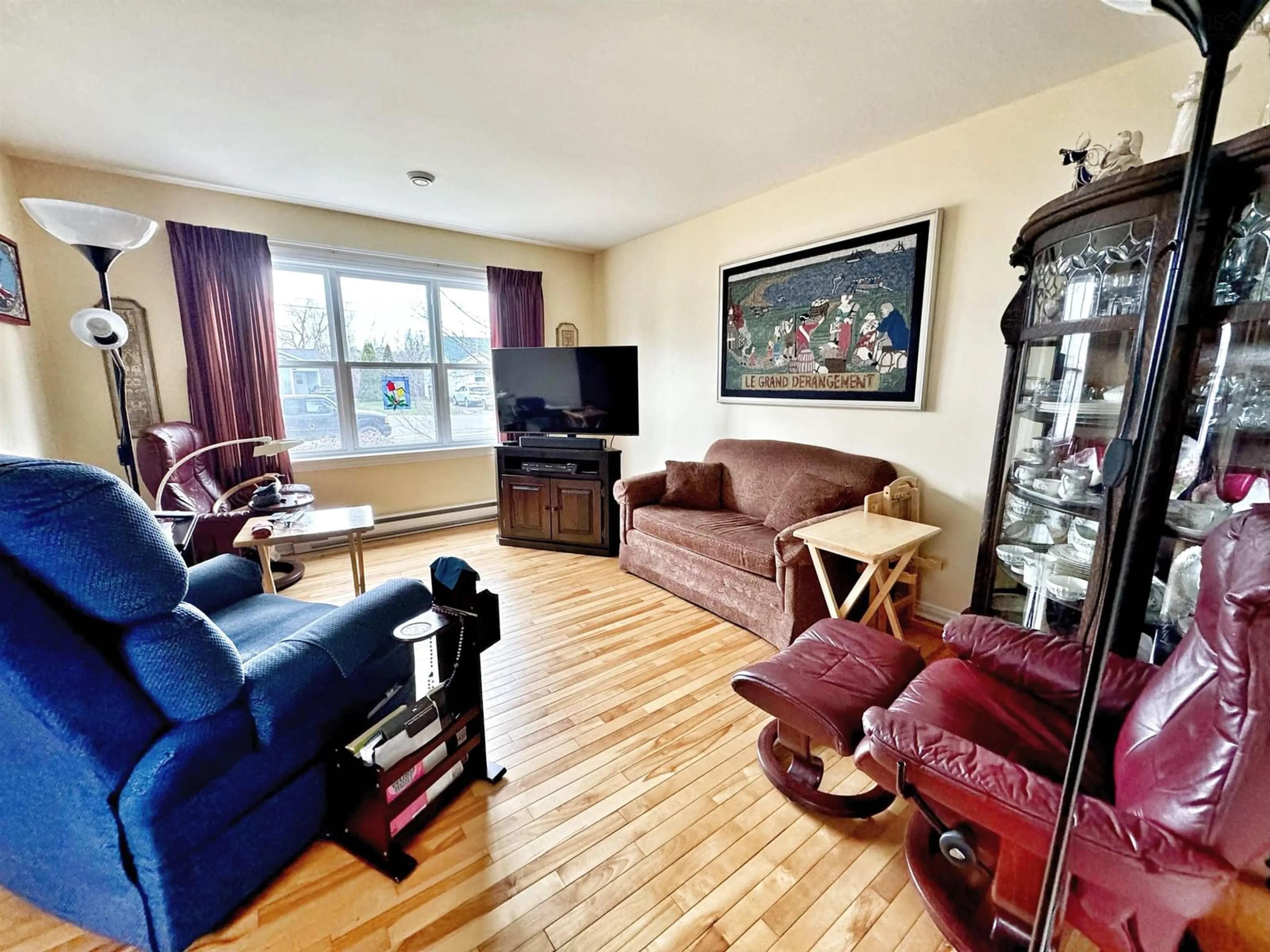 Living room with furniture, wood/laminate floor for 106 Pleasant St #A&B, Berwick Nova Scotia B0P 1E0