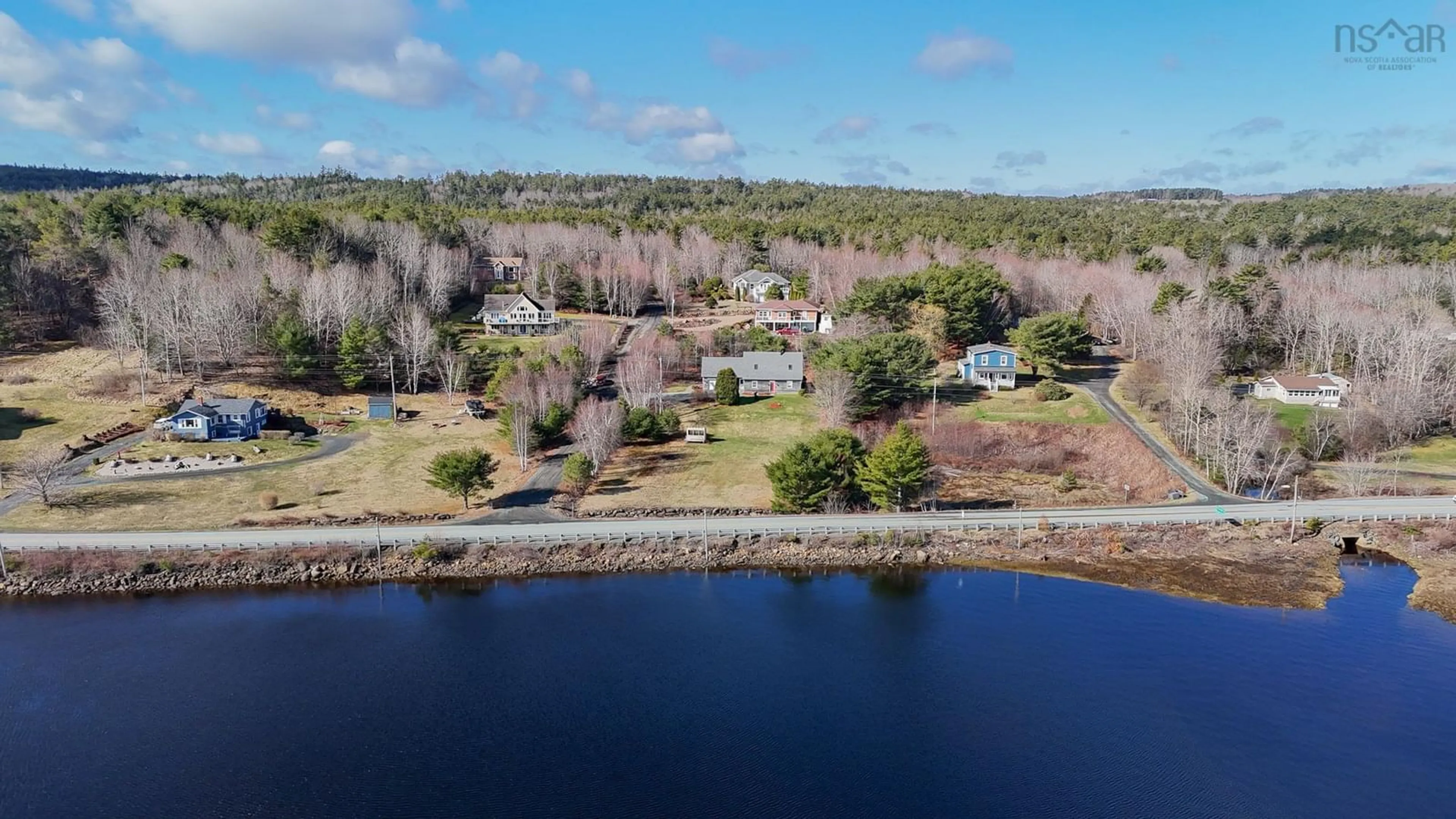 A pic from outside/outdoor area/front of a property/back of a property/a pic from drone, water/lake/river/ocean view for 12 Charles William Dr, West Lahave Nova Scotia B0R 1C0