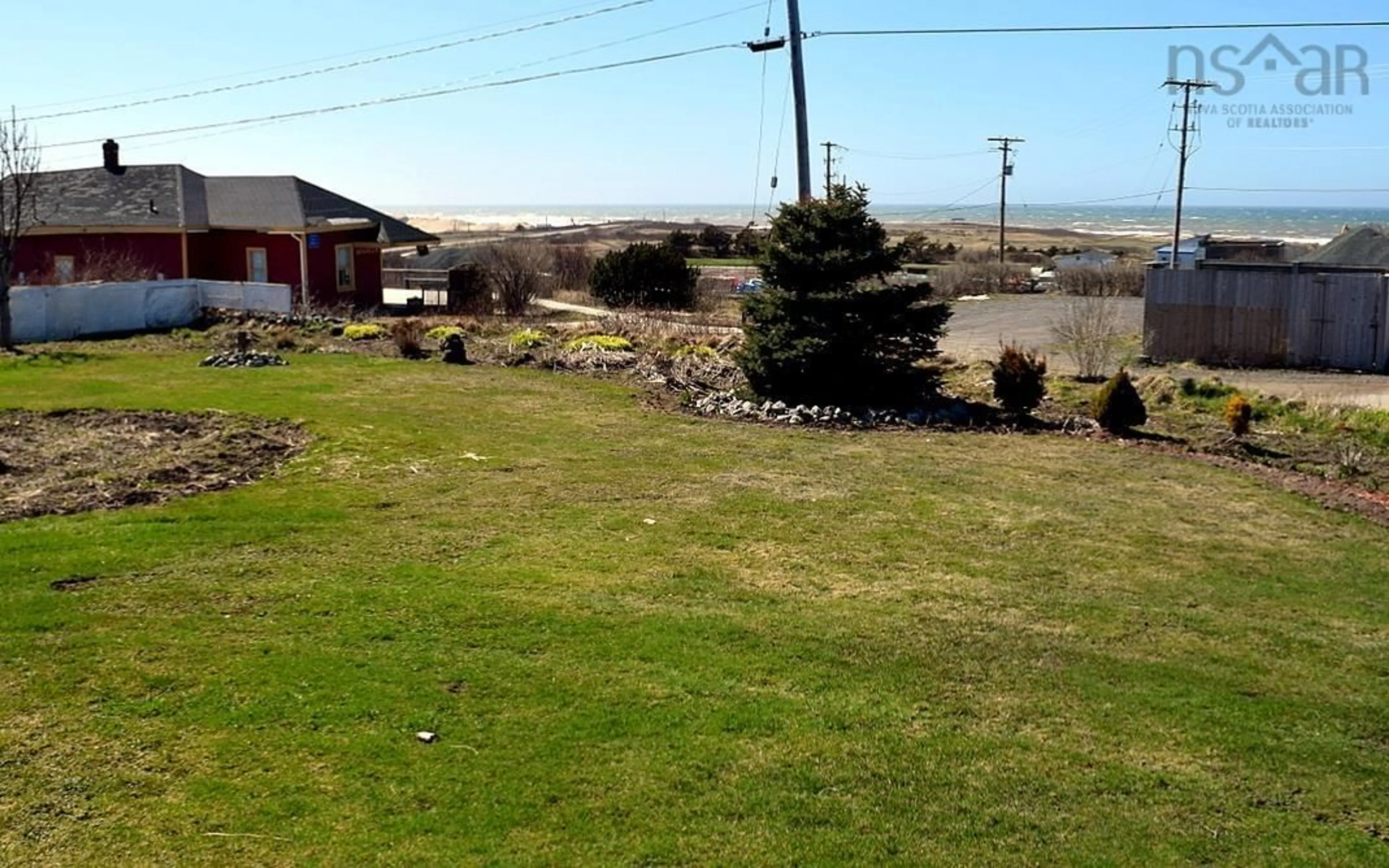 A pic from outside/outdoor area/front of a property/back of a property/a pic from drone, water/lake/river/ocean view for 43 Lower Railway St, Inverness Nova Scotia B0E 1N0
