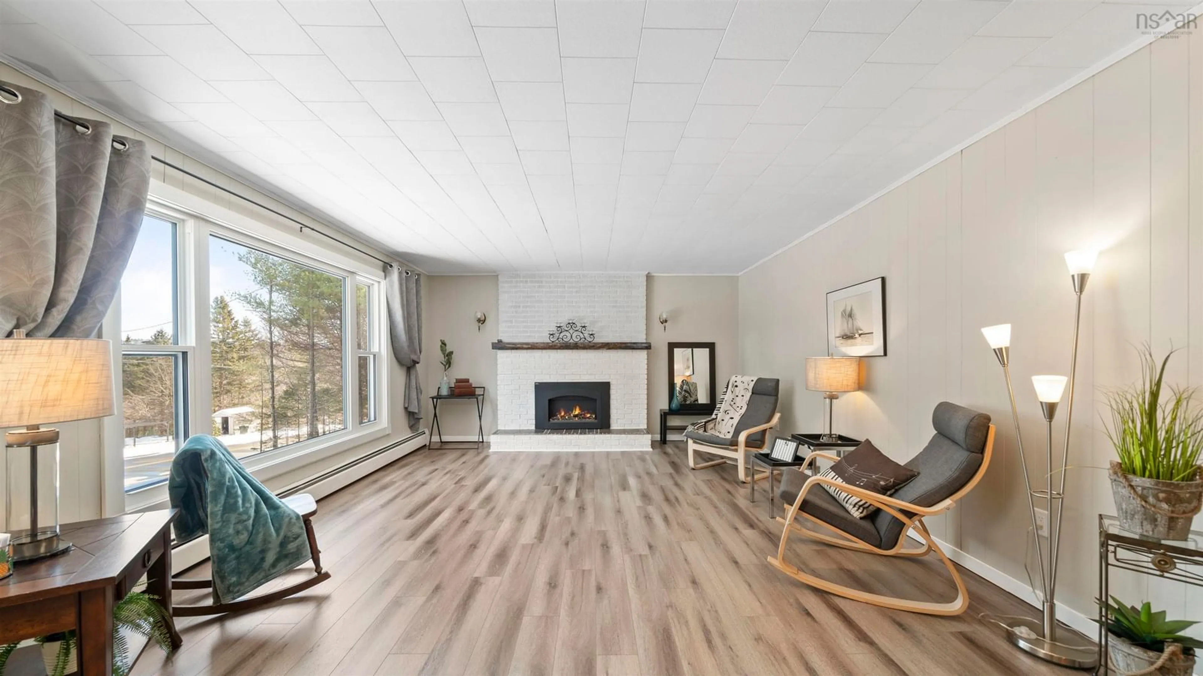 Living room with furniture, wood/laminate floor for 213 Lower Grant Rd, Chester Basin Nova Scotia B0J 1K0