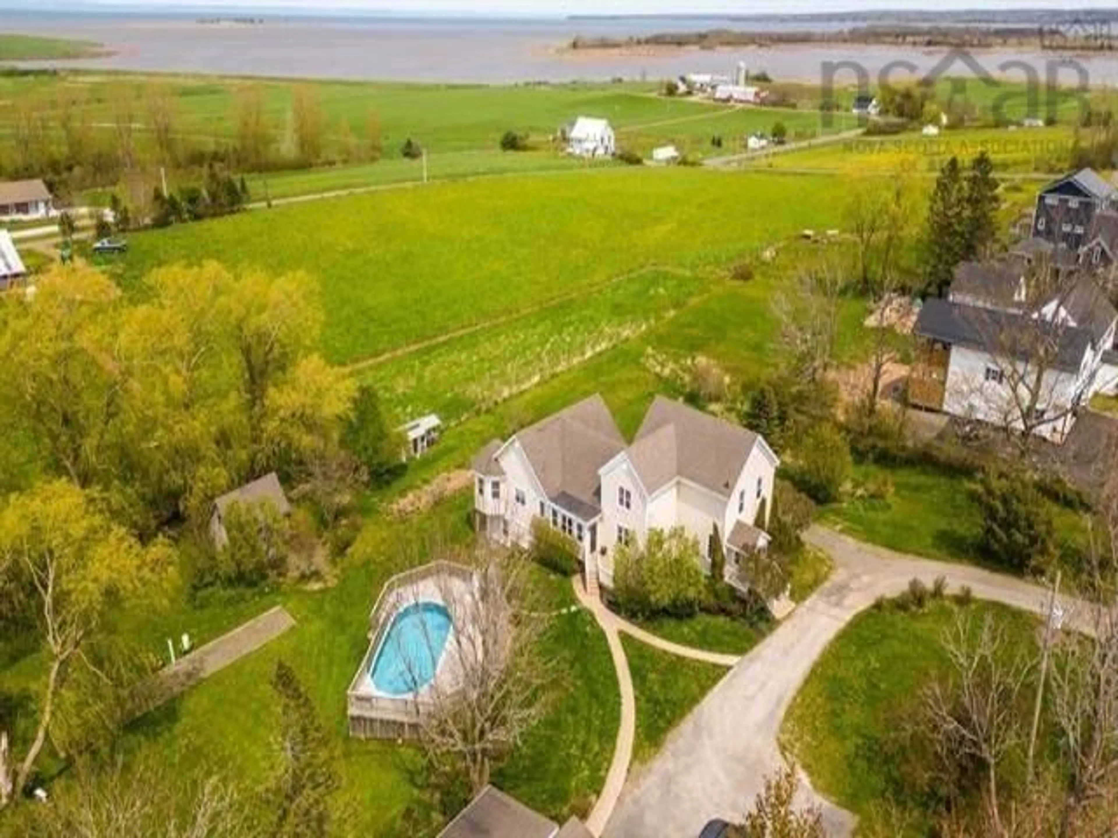 A pic from outside/outdoor area/front of a property/back of a property/a pic from drone, water/lake/river/ocean view for 53 King St, Hortonville Nova Scotia B4P 2R3