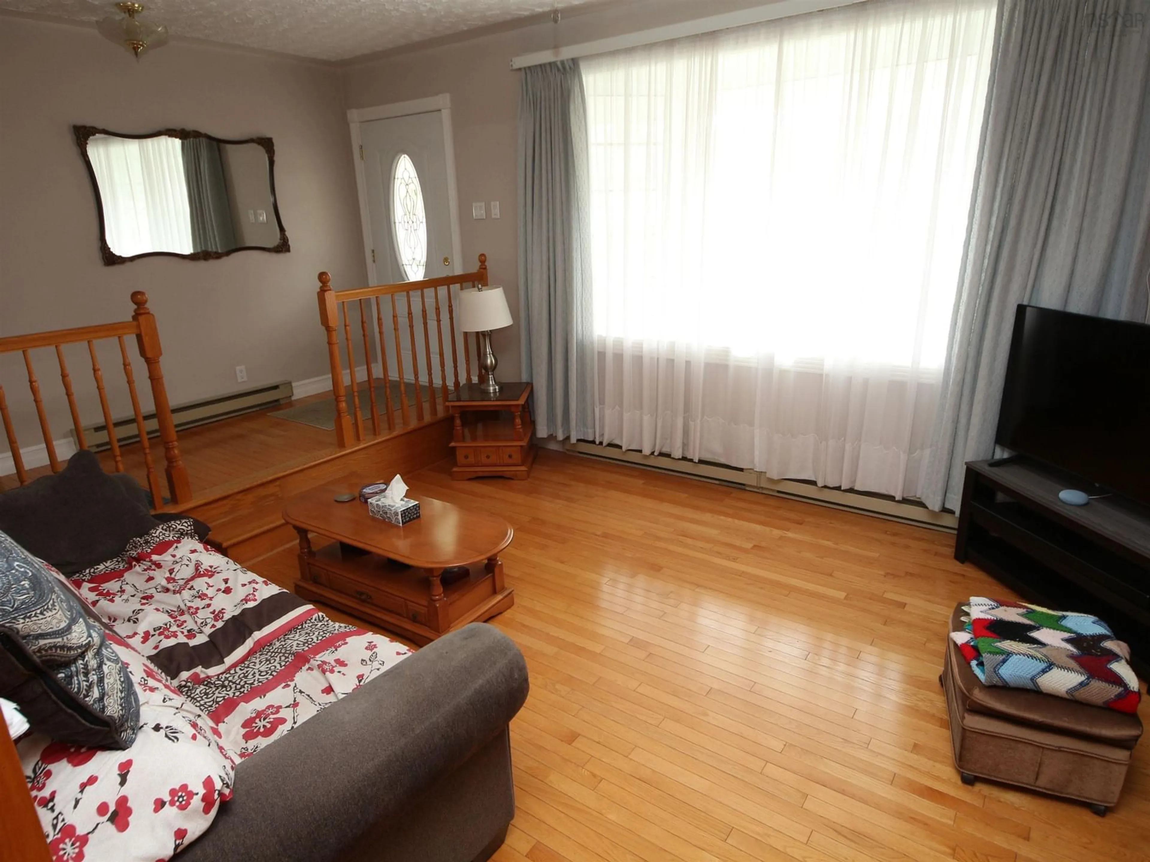 Living room with furniture, wood/laminate floor for 9 Kipling Dr, Lower Sackville Nova Scotia B4C 2X8