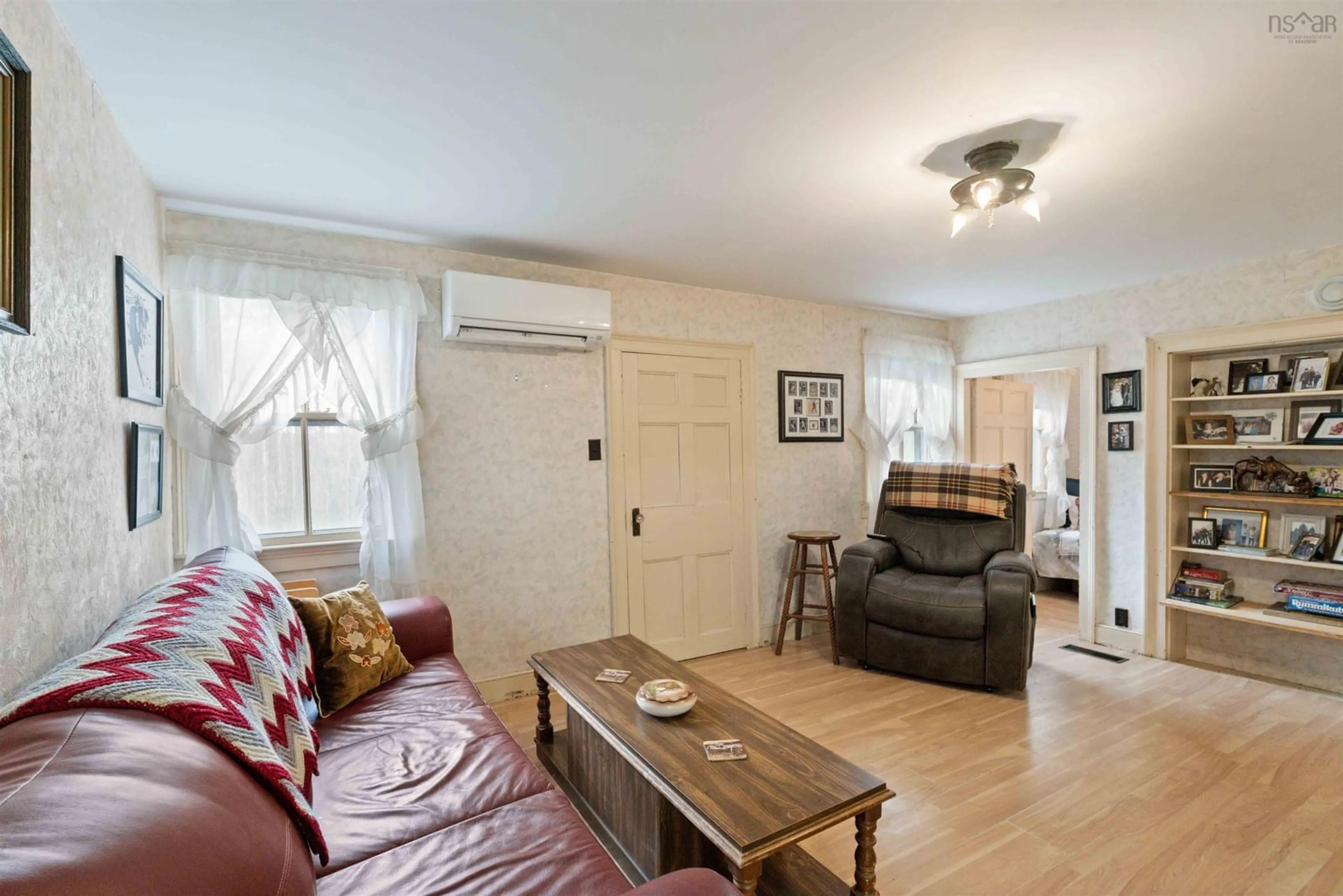 Living room with furniture, wood/laminate floor for 1539 362 Hwy, Victoria Vale Nova Scotia B0S 1P0