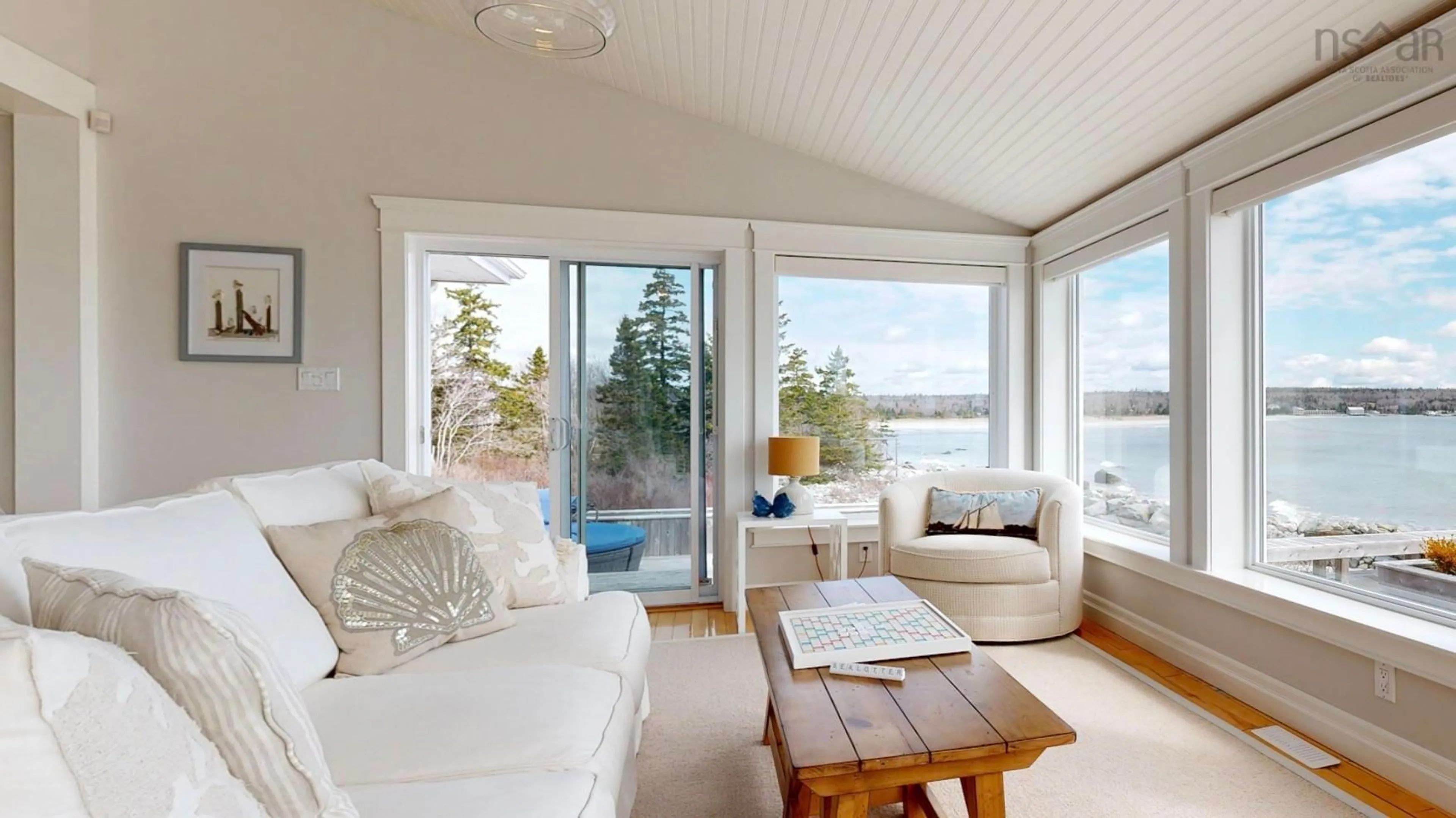Living room with furniture, wood/laminate floor for 147 Cosby Rd, Port Mouton Nova Scotia B0T 1T0