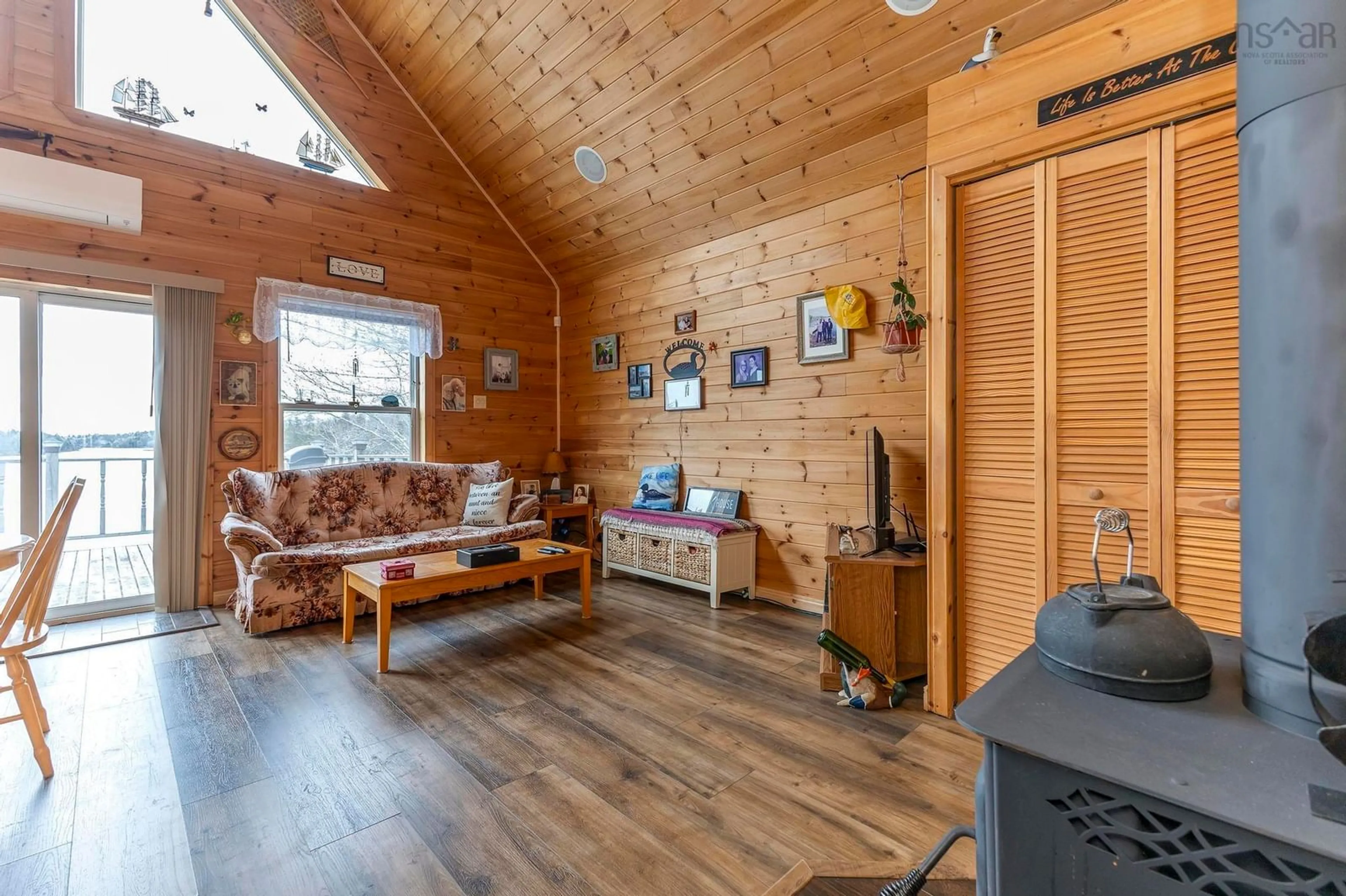 Living room with furniture, wood/laminate floor for 347 West Loon Village Rd, Upper Musquodoboit Nova Scotia B0N 2M0