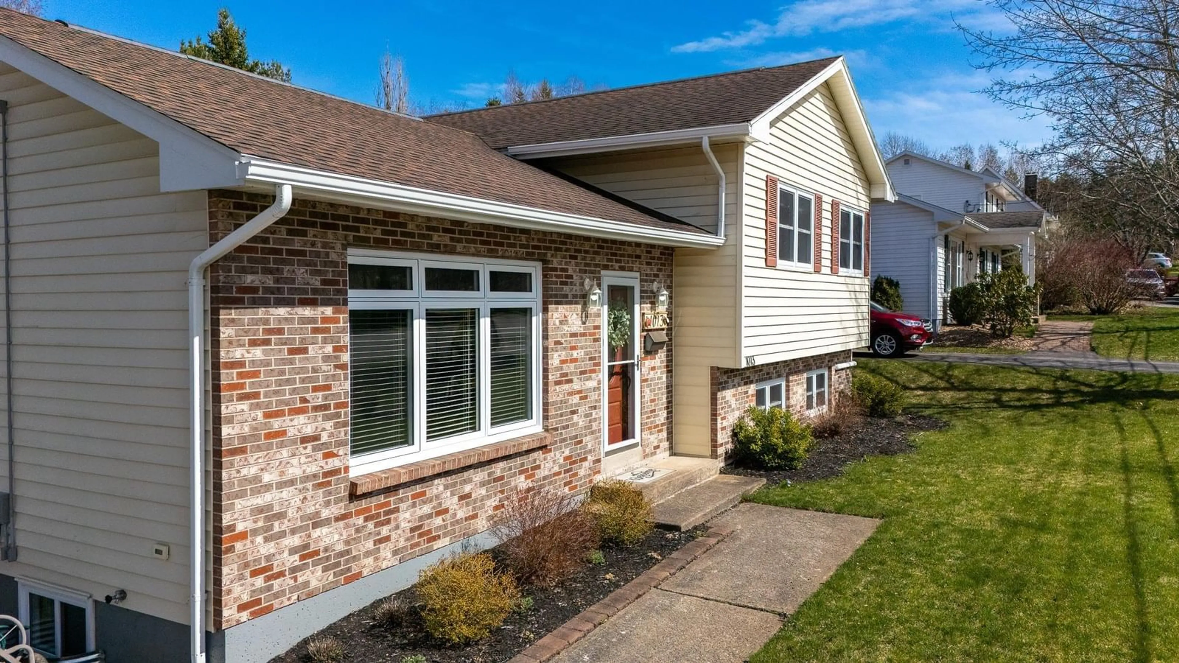 Home with vinyl exterior material, street for 1013 Country Club Blvd, New Minas Nova Scotia B4N 4W9