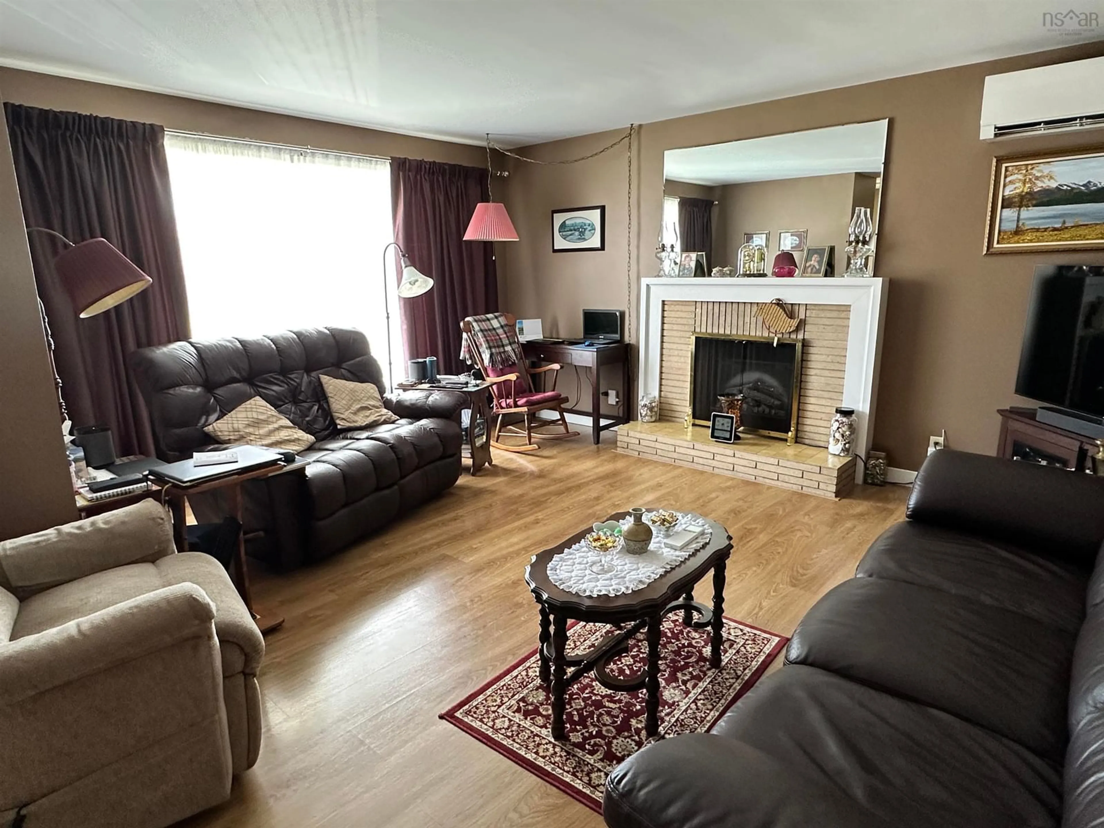 Living room with furniture, wood/laminate floor for 21 Bartling Ave, Liverpool Nova Scotia B0T 1K0