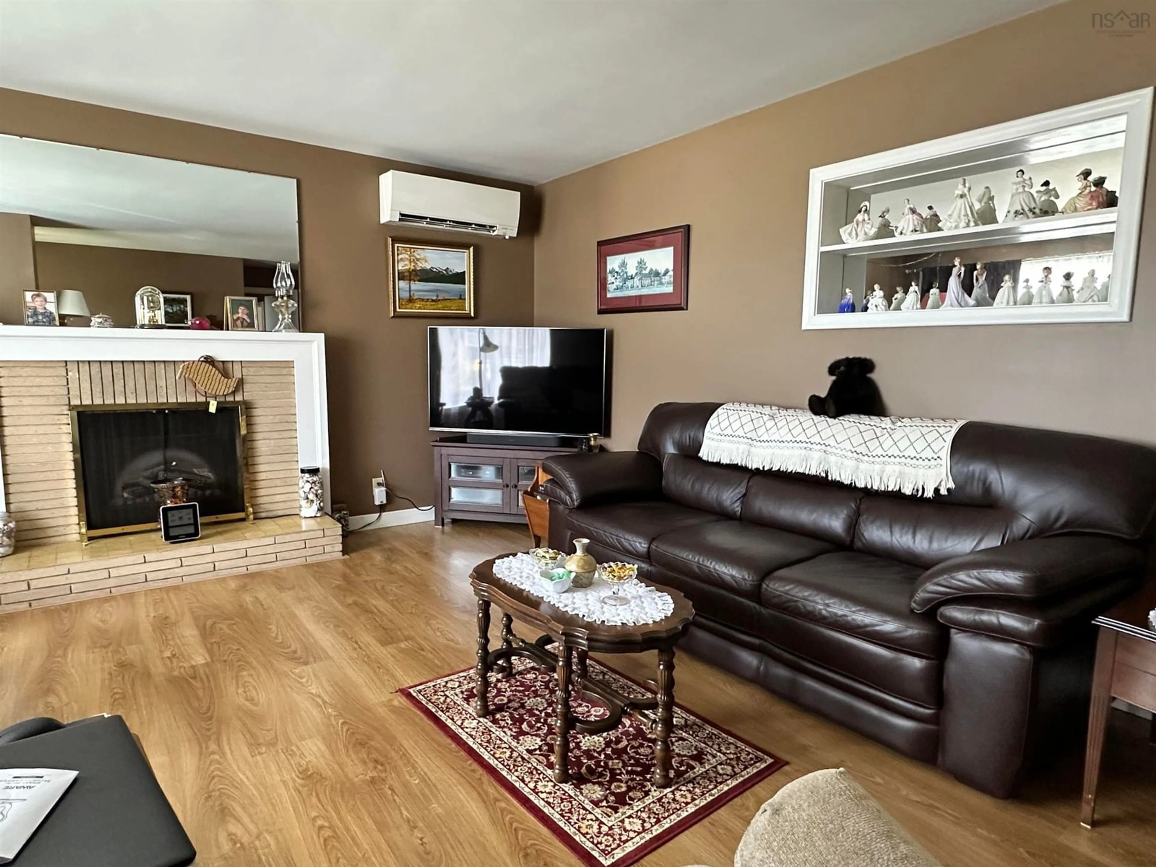 Living room with furniture, wood/laminate floor for 21 Bartling Ave, Liverpool Nova Scotia B0T 1K0