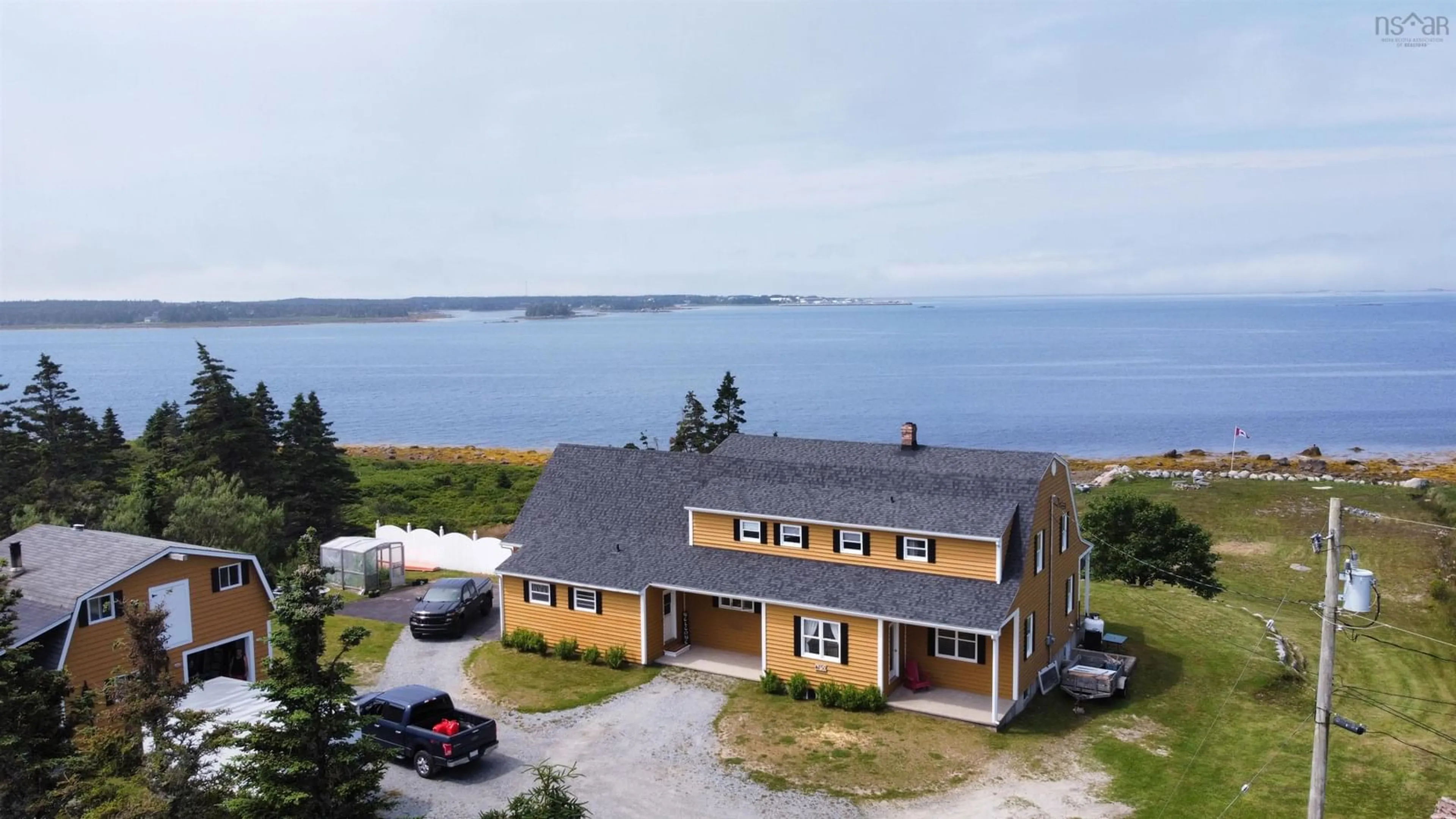 A pic from outside/outdoor area/front of a property/back of a property/a pic from drone, water/lake/river/ocean view for 850 330 Hwy, Centreville Nova Scotia B0W 2G0