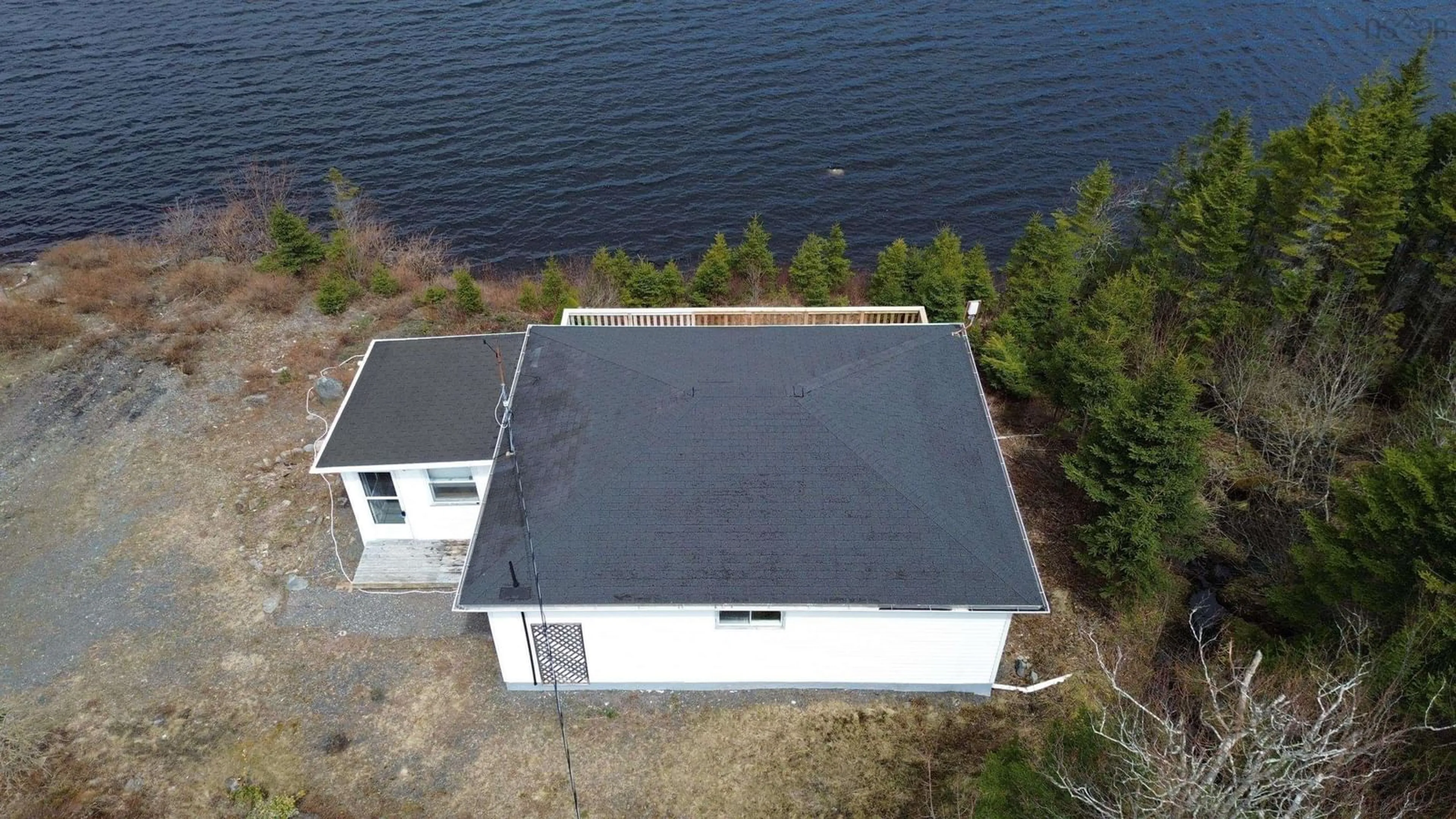 A pic from outside/outdoor area/front of a property/back of a property/a pic from drone, water/lake/river/ocean view for 2230 Larrys River Rd, Lundy Nova Scotia B0H 1N0