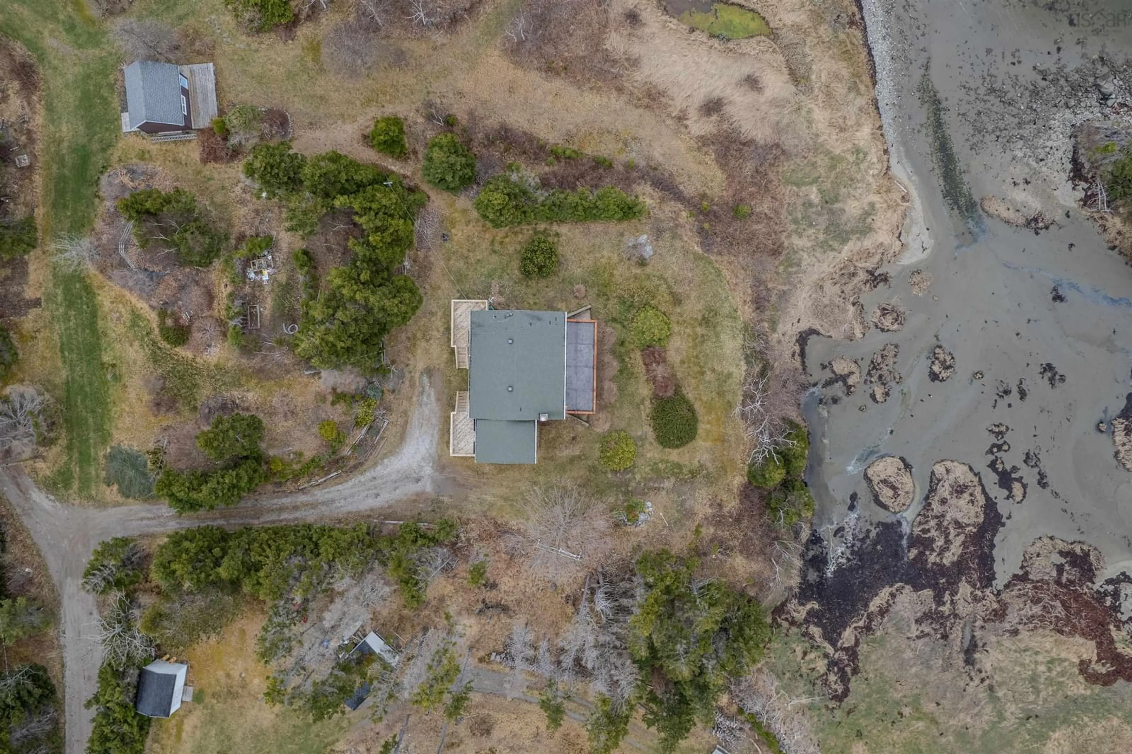 A pic from outside/outdoor area/front of a property/back of a property/a pic from drone, water/lake/river/ocean view for 130 Scottsdale Lane, Round Island Nova Scotia B1B 1P7