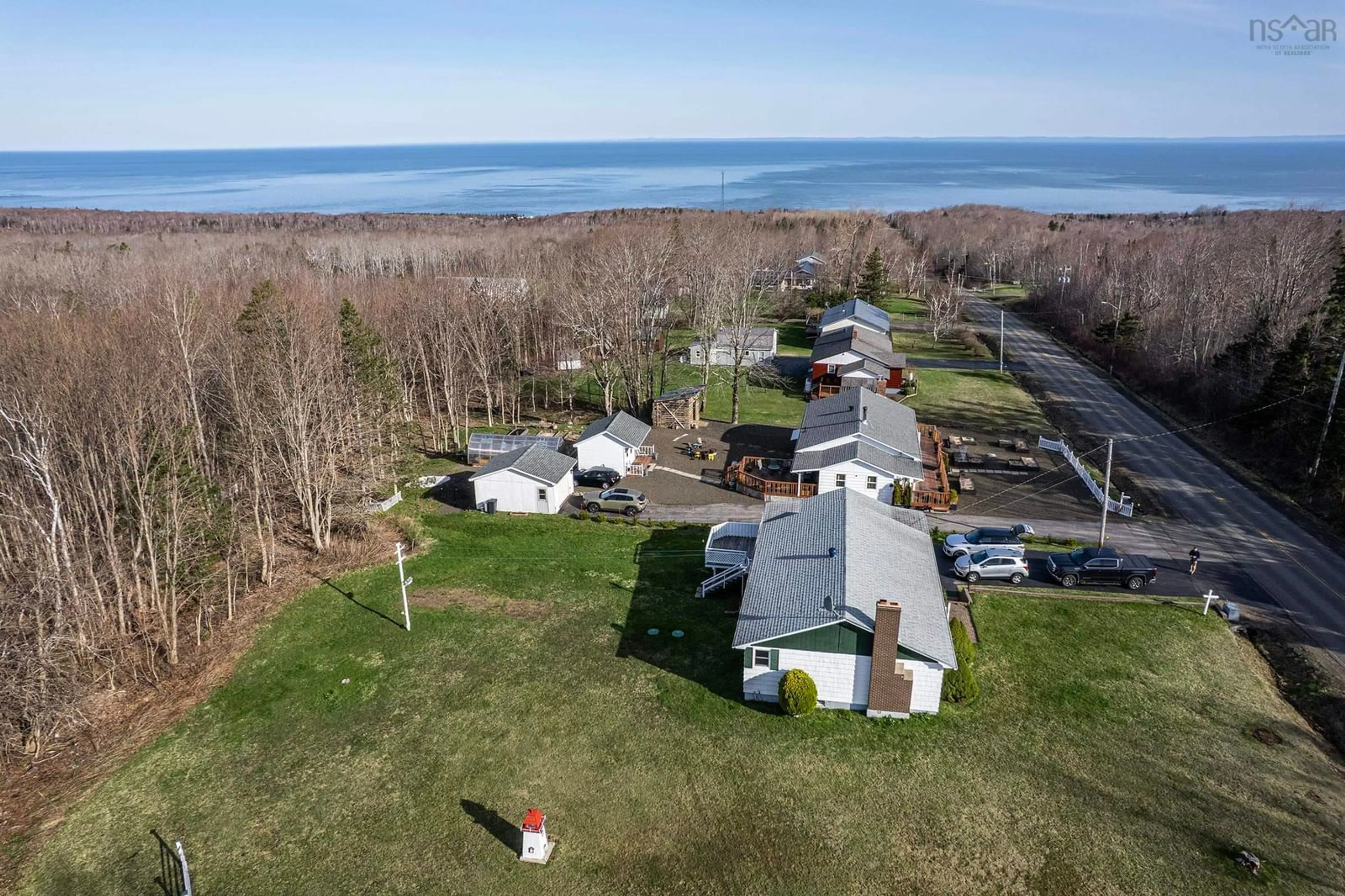 A pic from outside/outdoor area/front of a property/back of a property/a pic from drone, water/lake/river/ocean view for 975 Parker Mountain Rd, Parkers Cove Nova Scotia B0S 1A0