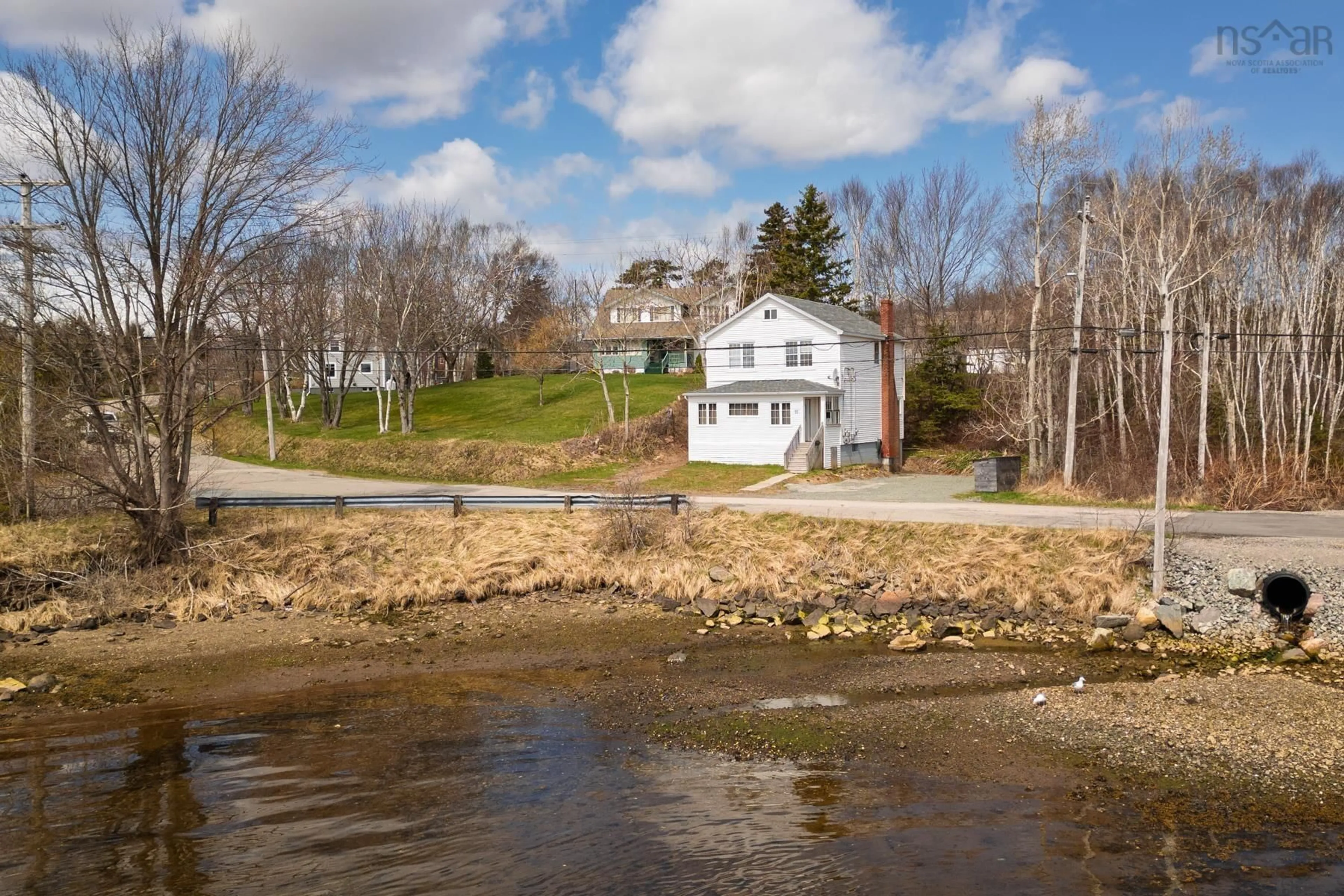 A pic from outside/outdoor area/front of a property/back of a property/a pic from drone, water/lake/river/ocean view for 55 Sunrise Dr, Westmount Nova Scotia B1R 1N6