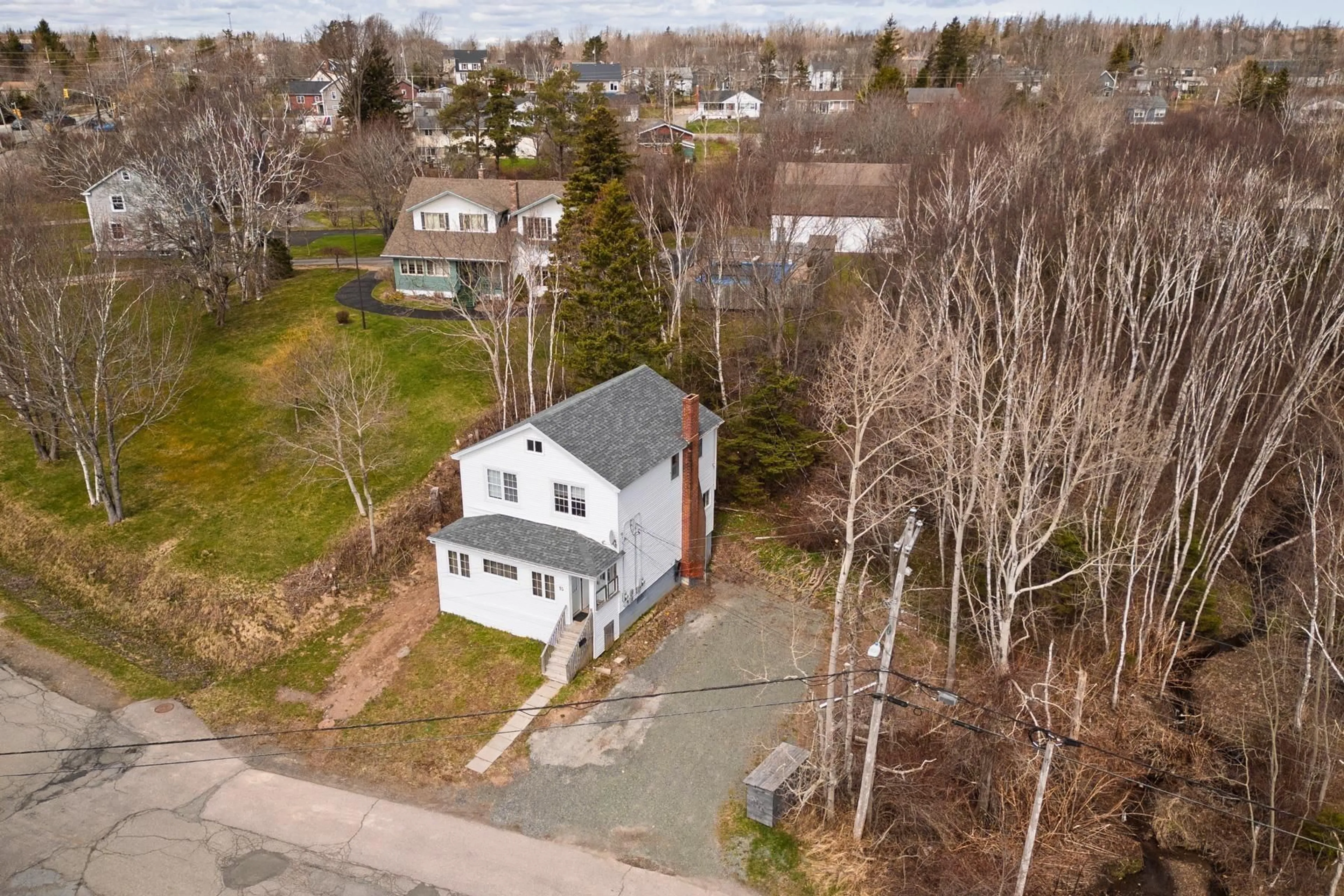 A pic from outside/outdoor area/front of a property/back of a property/a pic from drone, street for 55 Sunrise Dr, Westmount Nova Scotia B1R 1N6