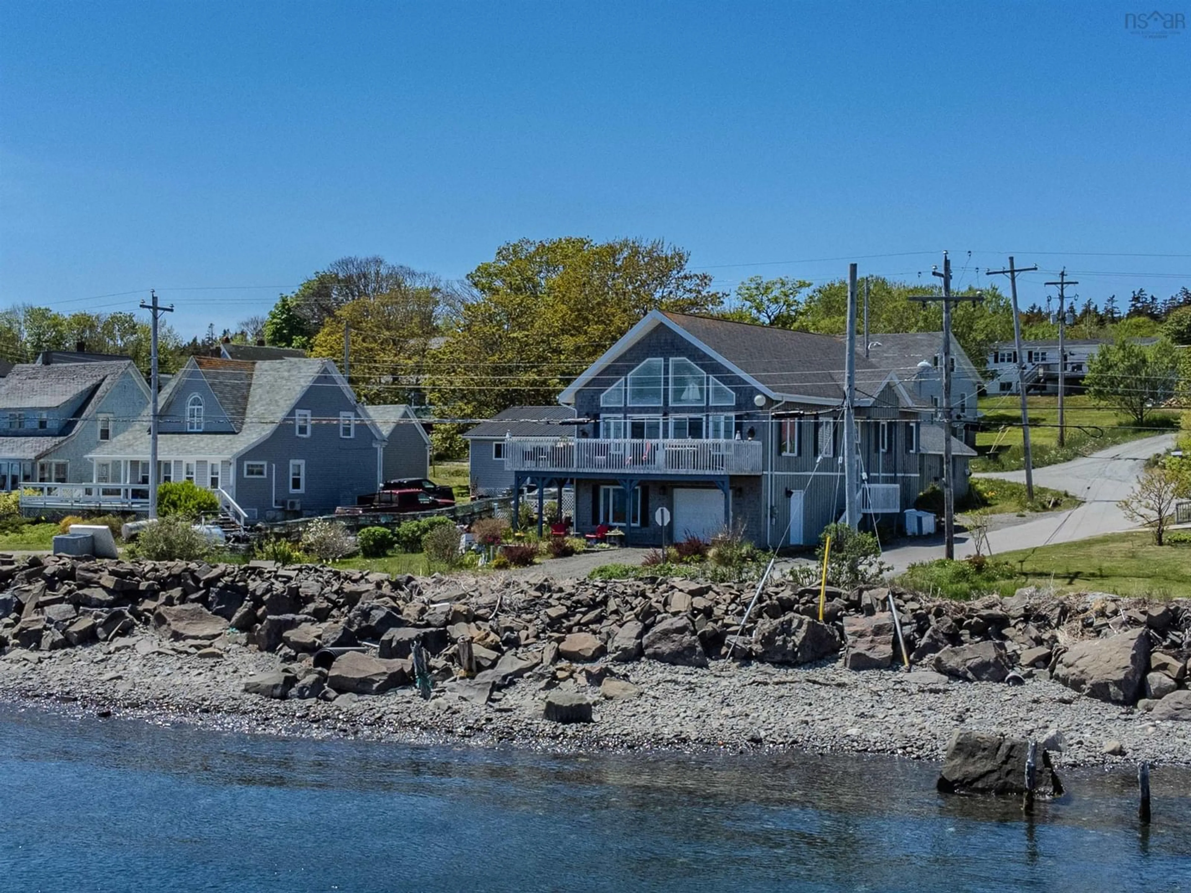 A pic from outside/outdoor area/front of a property/back of a property/a pic from drone, water/lake/river/ocean view for 389 Water Street, Westport Nova Scotia B0V 1H0