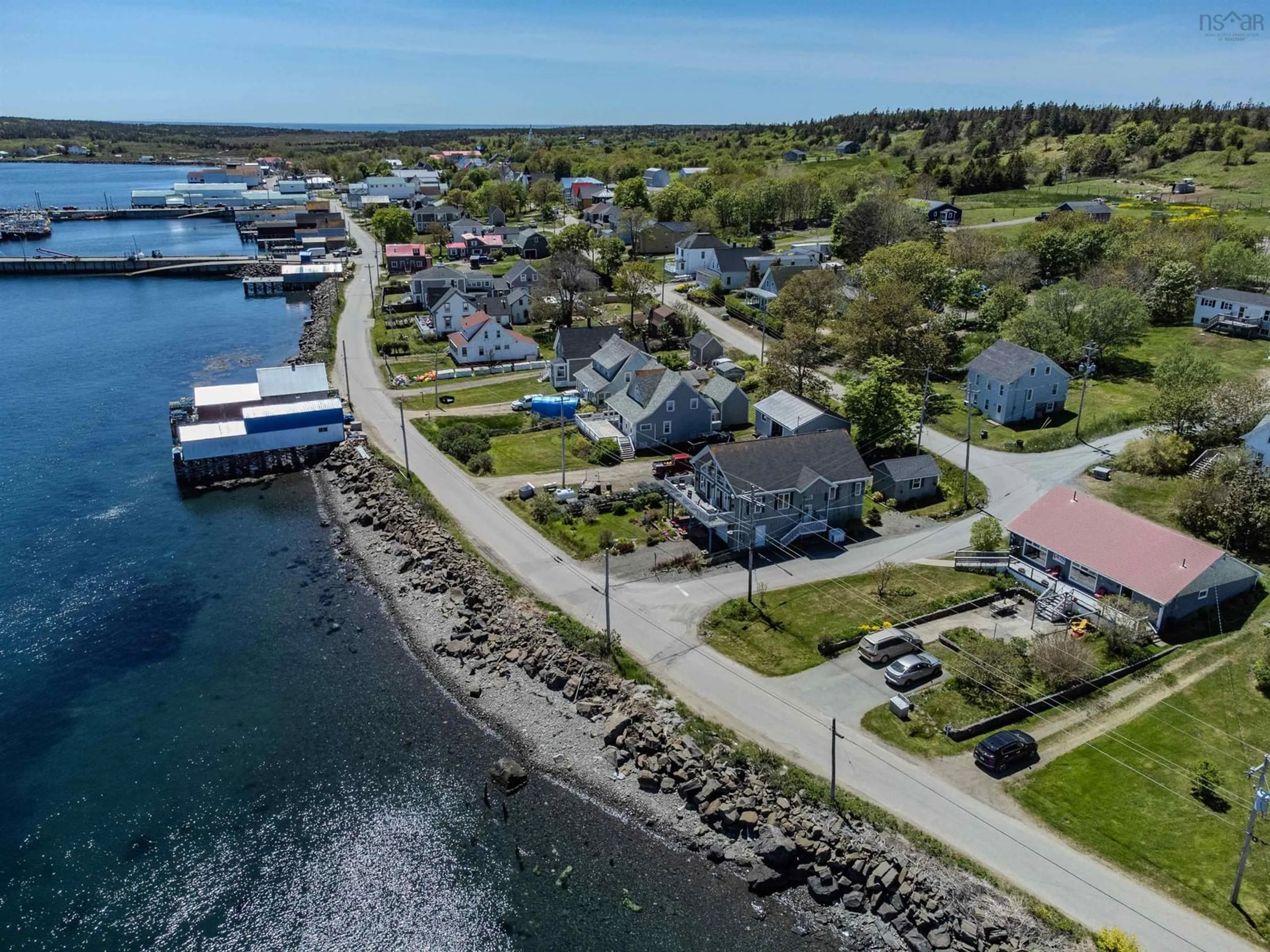 A pic from outside/outdoor area/front of a property/back of a property/a pic from drone, water/lake/river/ocean view for 389 Water Street, Westport Nova Scotia B0V 1H0