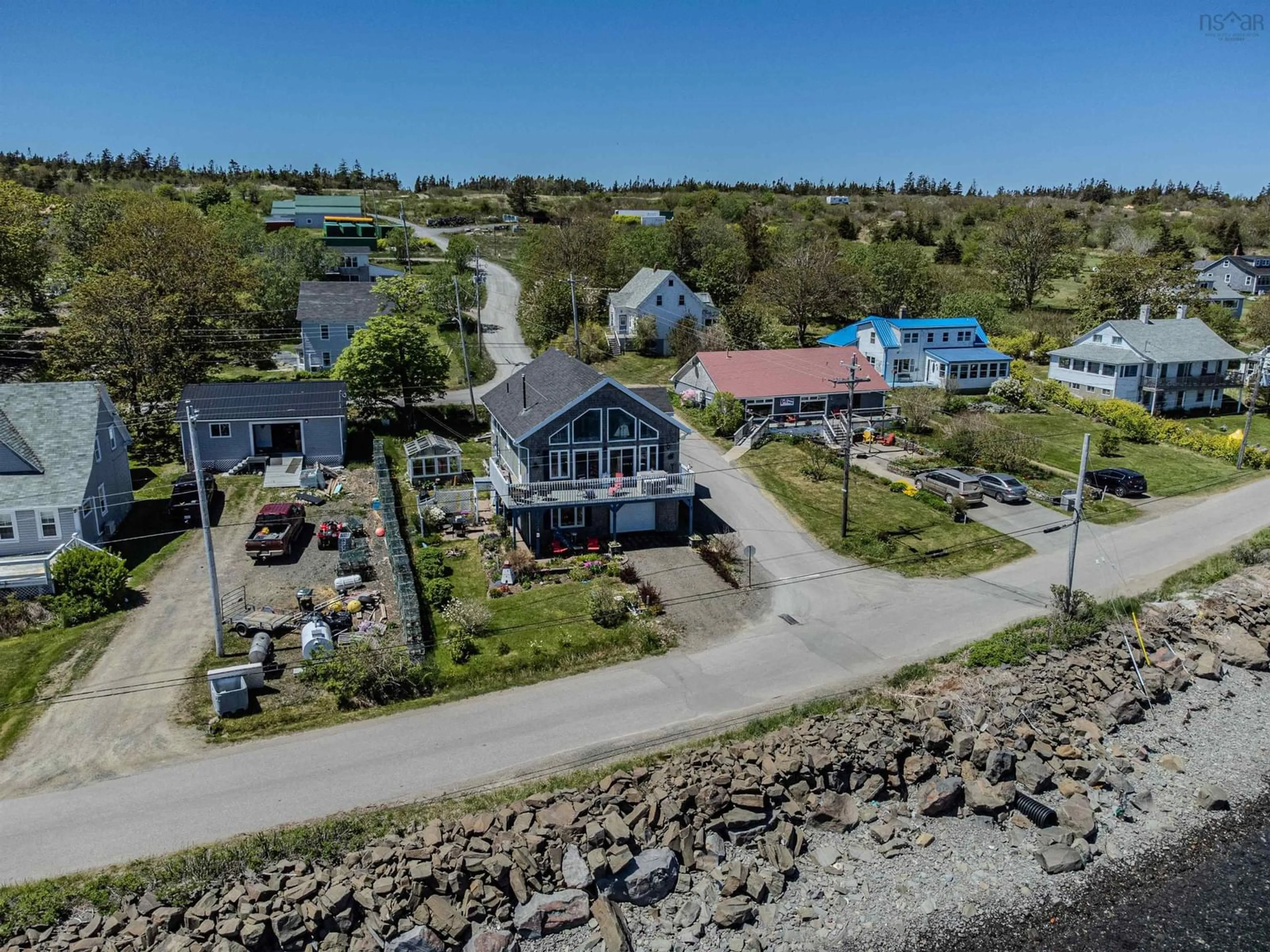 A pic from outside/outdoor area/front of a property/back of a property/a pic from drone, water/lake/river/ocean view for 389 Water Street, Westport Nova Scotia B0V 1H0