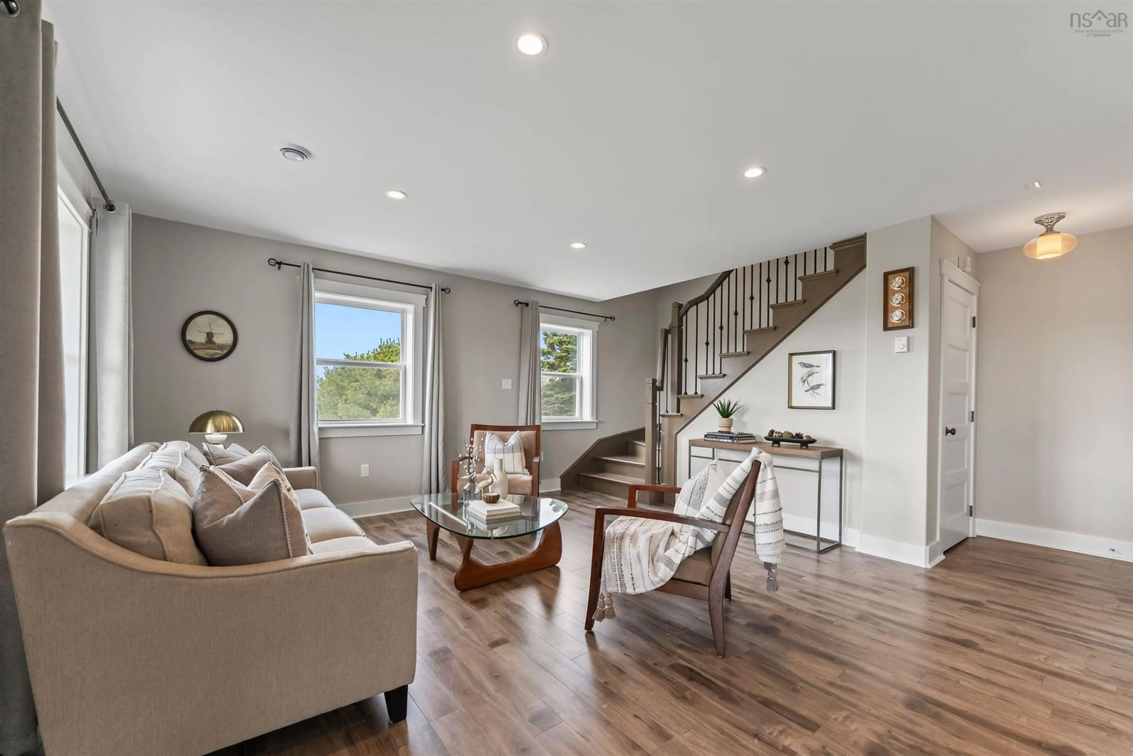 Living room with furniture, wood/laminate floor for 28 Fortune Lane, Head Of Chezzetcook Nova Scotia B0J 1N0