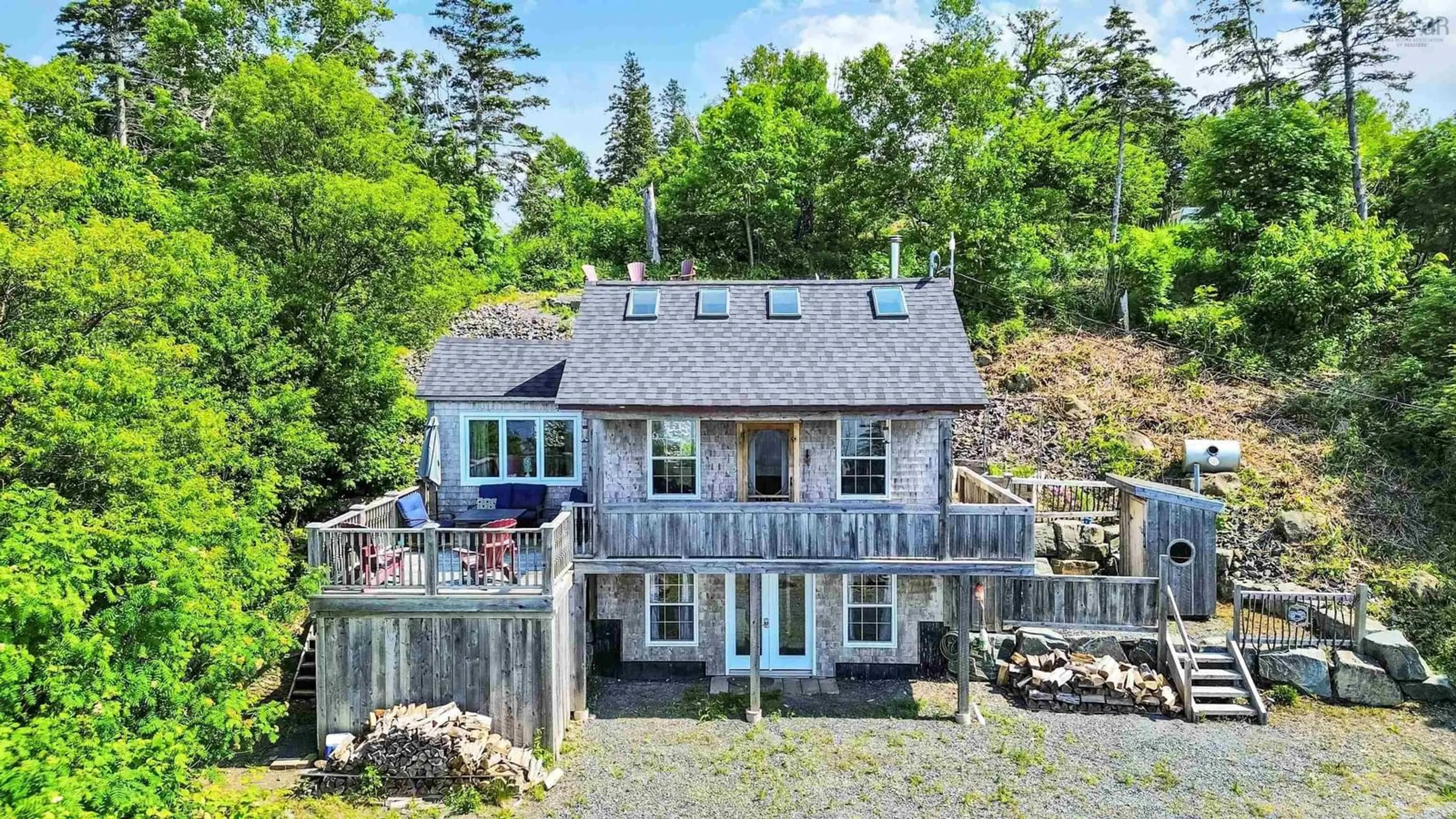 A pic from outside/outdoor area/front of a property/back of a property/a pic from drone, water/lake/river/ocean view for 54 Cove Rd, Halls Harbour Nova Scotia B0P 1J0