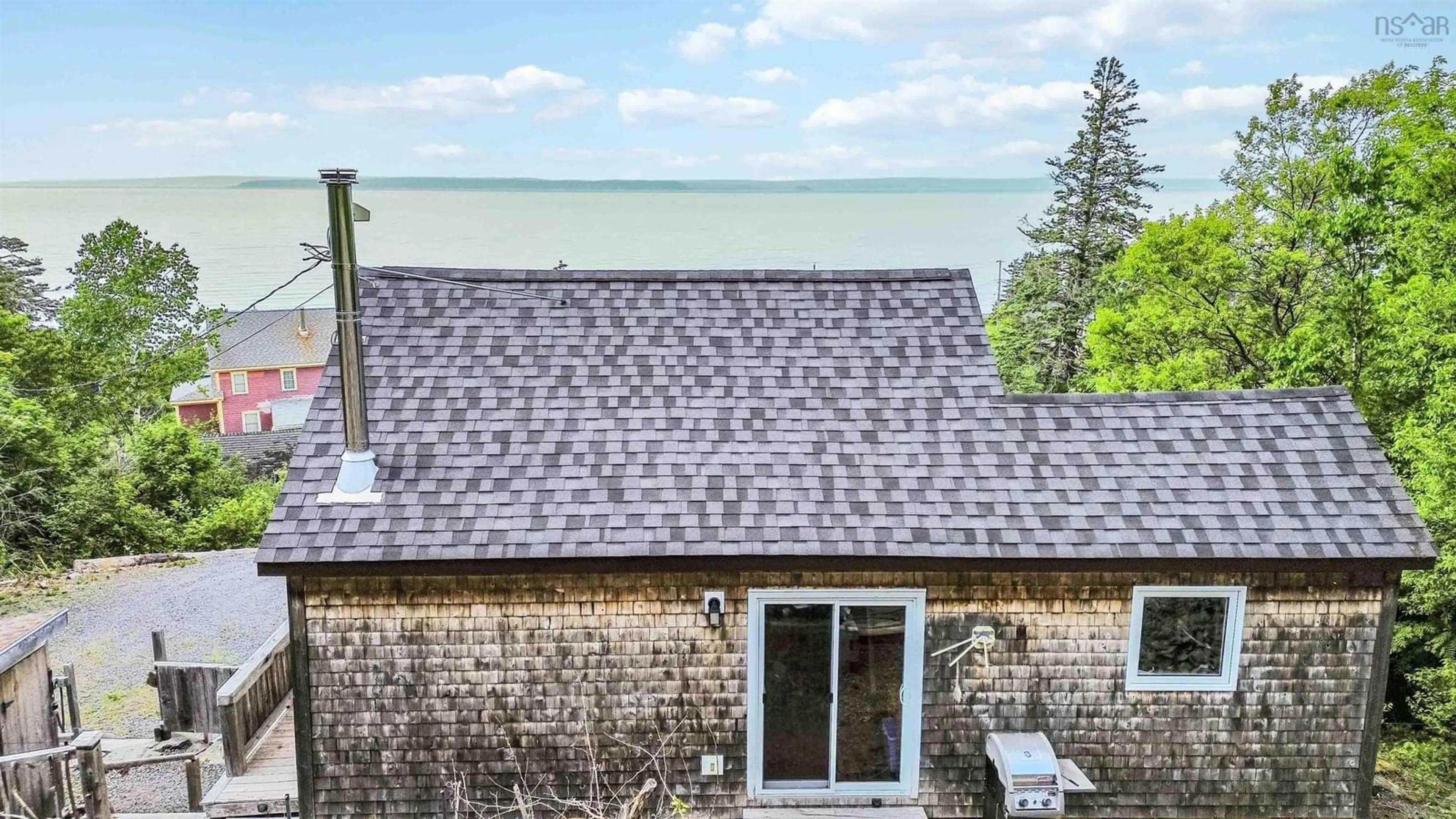 A pic from outside/outdoor area/front of a property/back of a property/a pic from drone, water/lake/river/ocean view for 54 Cove Rd, Halls Harbour Nova Scotia B0P 1J0